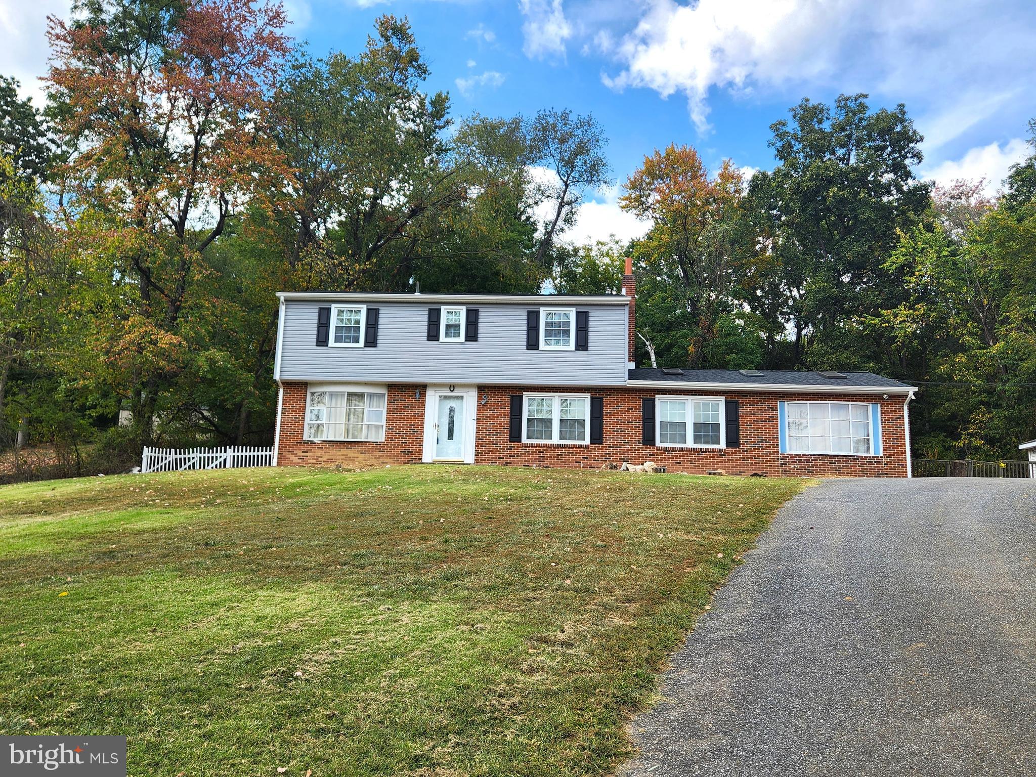 Looking for country living but staying in the heart of town? Look no further! The one you’ve been looking for is right here! This sizeable 4 bedroom, 2.5 bath home is located on almost an acre with the peace and tranquility of farmland and meadow views. 1st floor boasts formal living room, formal dining room and an expansive family room with faux beams, wood fireplace and pellet stove. Winter is coming and the leftover pellets are included! The laundry was relocated to the oversized1st floor bath, but connections remain in the basement if your vision would be to install a shower to make a 3rd full bath. Includes a detached 2 car garage plus dual entrances to a circular driveway which would be perfect for RV or trailer parking. Many mechanicals and major components have been updated since the current owner purchased including a new roof and new siding in 2021, basement waterproofing with transferable warranty in 2014, new boiler for heating in 2017. Priced to sell, this home boasts AMAZING POTENTIAL with a few updates to be done yet. A fantastic opportunity to be rewarded with some sweat equity!