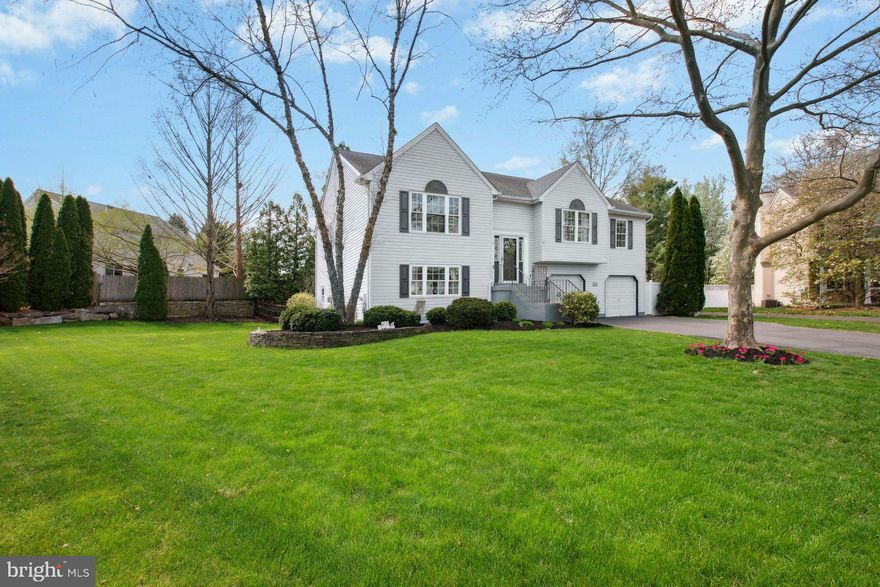 A Rare Find in Central Bucks School District! Tucked away at the end of a quiet cul-de-sac, this beautifully updated 4-bedroom, 3-bathroom home sits on a premium lot, surrounded by luscious landscaping that creates a true private retreat. Step inside to an airy open floor plan where the living room impresses with soaring vaulted ceilings and plenty of windows that flood the space with natural light. The formal dining room adjoins a tastefully renovated kitchen featuring an oversized island, granite countertops, stainless steel appliances, a pantry, and generous cabinetry—perfect for both everyday living and entertaining.
The gracious primary suite is a true escape with cathedral ceilings, a walk-in closet, and a remodeled en-suite bathroom complete with a soaking tub, separate shower, and double vanity with granite countertops. 
 Two additional spacious bedrooms and a fully renovated hall bathroom round out the main level. The above-grade lower level offers incredible flexibility with a large family room, a versatile multi-purpose room, an additional bedroom, a full bathroom, and a dedicated laundry room. With its own entrance and full amenities, this space is ideal for multi-generational living, an au pair or nanny suite, or a private home office. Outdoor living shines here—step out onto the expansive composite deck that runs the length of the main level, complete with a covered area perfect for al fresco dining, relaxing, or entertaining. Below, a lower-level patio offers a covered hot tub and easy access to the fully fenced yard, which is beautifully enclosed by mature plantings for added privacy and natural beauty. This truly move-in-ready home offers comfort, versatility, and an exceptional location within a top-rated school district.