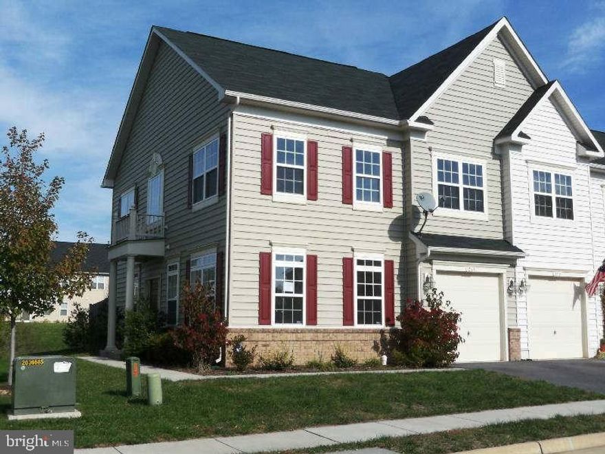 End unit town home with new carpets and fresh paint!  Spacious bedrooms and tons of closet space. Updated kitchen with pantry, fire-placed family room. Private setting backs to woods.