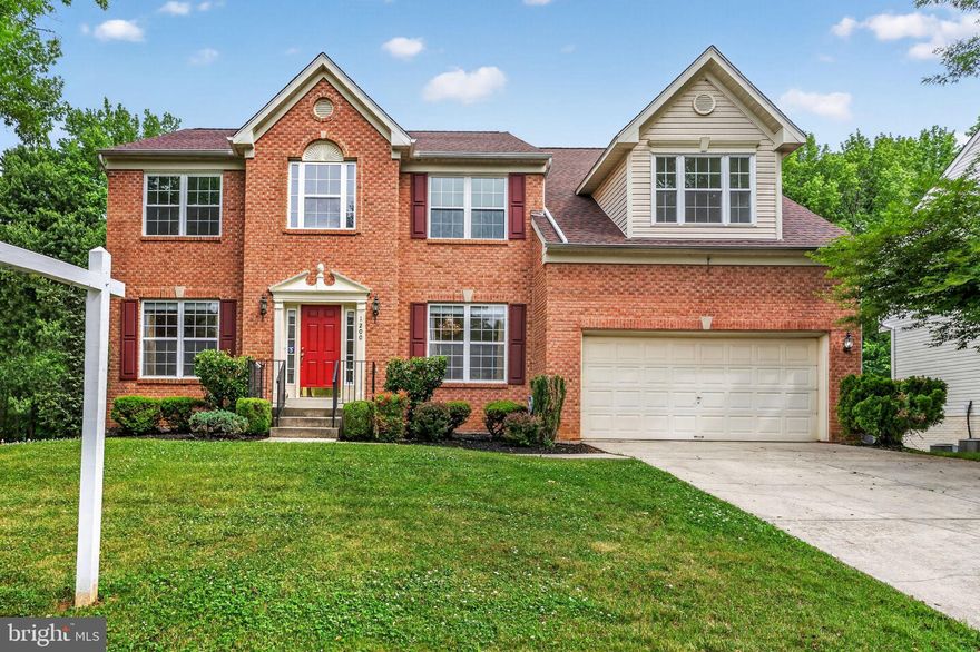 Nearly 5,000 square feet of beautifully finished living space awaits in this impressive brick-front Colonial featuring a removed renovated-not the case gourmet kitchen, multiple recently renovated custom resort-style bathrooms, new upper level energy efficient windows and a flexible floor plan ideal for multigenerational living. Perfectly positioned on one of the best lots in the neighborhood backing to woods for exceptional privacy, this elegant home offers luxury, comfort, and functionality throughout.  A rare main-level bedroom with access to a fully custom renovated full bath creates the perfect setup for in-laws, extended family, or long-term guests. The grand two-story foyer with hardwood flooring and upgraded trim sets the tone for this beautifully maintained home. The formal dining room showcases a luxurious designer chandelier  and ceiling medallion, extensive trim work, including wainscoting, chair rail, crown molding.  While the formal living room with decorative columns adds timeless character. The dramatic two-story family room features hardwood flooring, a gas fireplace with marble surround and wood mantel, designer ceiling fan, and custom built-in entertainment center. The family room opens seamlessly into the breakfast nook and kitchen featuring granite countertops, 42” oak cabinetry, pantry, built-in desk area, and stainless steel appliances.  To include, a new sleek modern french door refrigerator. A pass-through opening connects the kitchen to the huge sunroom with cathedral ceiling, hardwood flooring, and peaceful wooded views of the private backyard. The renovated main-level full bath offers floor-to-ceiling quartz walls, quartz flooring, oversized luxury shower with rainfall and body spray system, designer vanity, chandelier, and illuminated mirror. The adjacent main-level bedroom has also been renovated with hardwood flooring and recessed lighting. Upstairs you’ll find four spacious bedrooms including a luxurious owner’s suite with tray ceiling, recessed lighting, sitting area, walk-in closet with organizer system, and a renovated spa-style bath featuring quartz tile, soaking tub, and separate vanities. The upper level also offers a convenient laundry room and another renovated hall bath. The fully finished walkout basement provides exceptional additional living space including a gym, massive recreation room with recessed lighting and crown molding, sixth bedroom, and another renovated full bath. Additional upgrades include new six-panel doors throughout, newer gas furnace and hot water heater, radon mitigation system, and abundant storage space. Outdoor living is equally impressive with a large deck and stairs leading to expansive stamped concrete patios perfect for entertaining. The private backyard backs to mature woods and includes a large storage shed. Additional features include a front-load two-car garage with overhead storage and up to 4 additional parking spaces in the driveway, irrigation system being sold as-is, and a roof approximately 8-9 years old. This exceptional property offers the perfect blend of luxury, space, and privacy in a highly desirable setting.