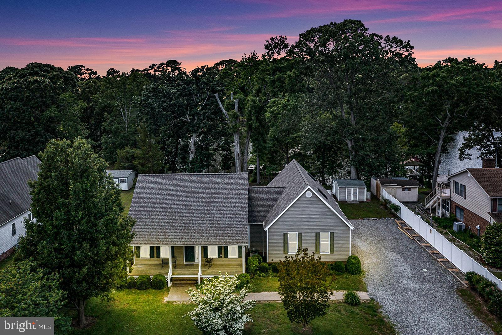 Discover comfortable waterfront living in this spacious three-bedroom, two-bathroom home nestled in Bay Harbor Estates, part of Virginia’s scenic Northern Neck. Located on protected Bridge Creek, just off the Little Wicomico River, this well-designed residence combines thoughtful layout with scenic charm. Interior highlights: welcoming entryway with ceramic tile floors that leads to a Formal Dining Room, Bright Living Room with stone gas log fireplace, vaulted ceilings and wall of windows framing the serene water views, main level Primary Suite with walk-in closet & Ensuite Primary Bathroom, 2 Guest Bedrooms & another Full Bath. Above the attached garage, a bonus suite offers flexible living arrangements with its own bedroom, full bathroom, kitchenette, and a cozy living area—ideal for guests, extended family, or anyone in need of their own mini-retreat. Outside, the property shines with an impressive pier complex equipped with a boat house, boat lift, and jet ski lift. A covered back deck provides the perfect spot to sip your morning coffee or unwind at day’s end, all while enjoying the peaceful creek views. Additional perks include a whole-home generator, storage shed, and an attached garage. Come and see all that this home has to offer for great waterfront living!