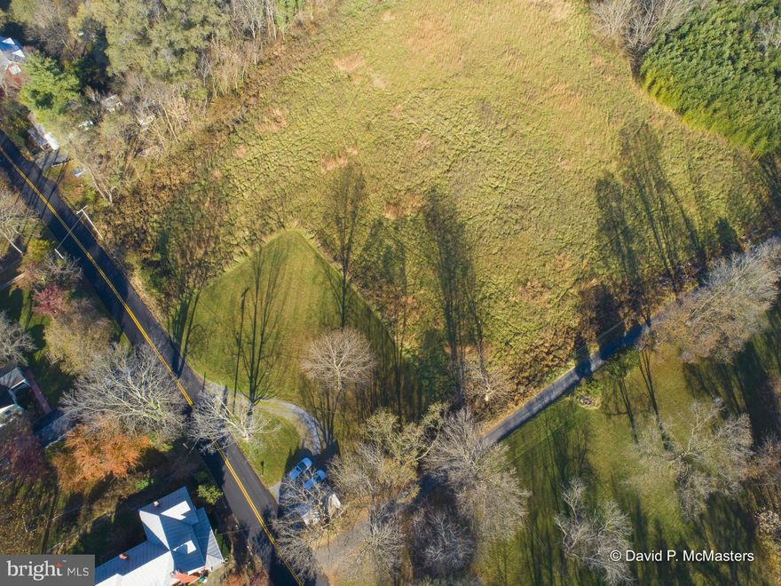 Desirable Shepherdstown. Great location minutes to town.  Lovely 4.88 Acre  lot on River Rd, just before it descends to run along the Potomac River towards Harpers Ferry.   BUILDERS TAKE NOTE: One house site or possibly three!!!
It has a small garage/shed and ample road frontage on River Rd. and Lukens Lane.The land is about 80% cleared. At the bottom border of the land is a stand of bamboo. The garage is currently used as a shed by neighbors.  NB: AN ENGINEERING FIRM HAS DETERMINED THAT THIS PARCEL IS ELIGIBLE FOR SUBDIVISION INTO TWO ADDITIONAL LOTS PLUS A REMAINDER PARCEL. IT IS WITHIN THE SHEPHERDSTOWN  GROWTH MANAGEMENT BOUNDARY. Subject to Jefferson County Planning and Zoning Approval.  See information in attached documents.  It has very pleasant views and is 5 minutes to downtown Shepherdstown, and 10 minutes to the MARC commuter train to Union Station with stops in the Maryland "Federal" suburbs. Shepherdstown is home to Shepherd University as well as a vibrant downtown area containing multiple specialty shops and restaurants. The Shepherdstown market has commanded the highest sales prices for real estate in all of Jefferson County over the past several years.