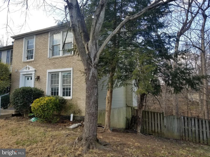BACK ON THE MARKET! Application fell through! Their Loss is Your Gain! Newly renovated and extremely spacious End Unit with Brick front and fenced rear yard. Lovely wood burning fireplace in the finished walkout basement, excellent layout, with 2 full baths and 2 half baths.  New paint, engineered wood and carpeting throughout.  Property shows very well. Backs to trees! Near to 95, Route 1, Quantico, Ft Belvoir , Potomac River, Shopping and much more! You'll love it! Owner is Agent.