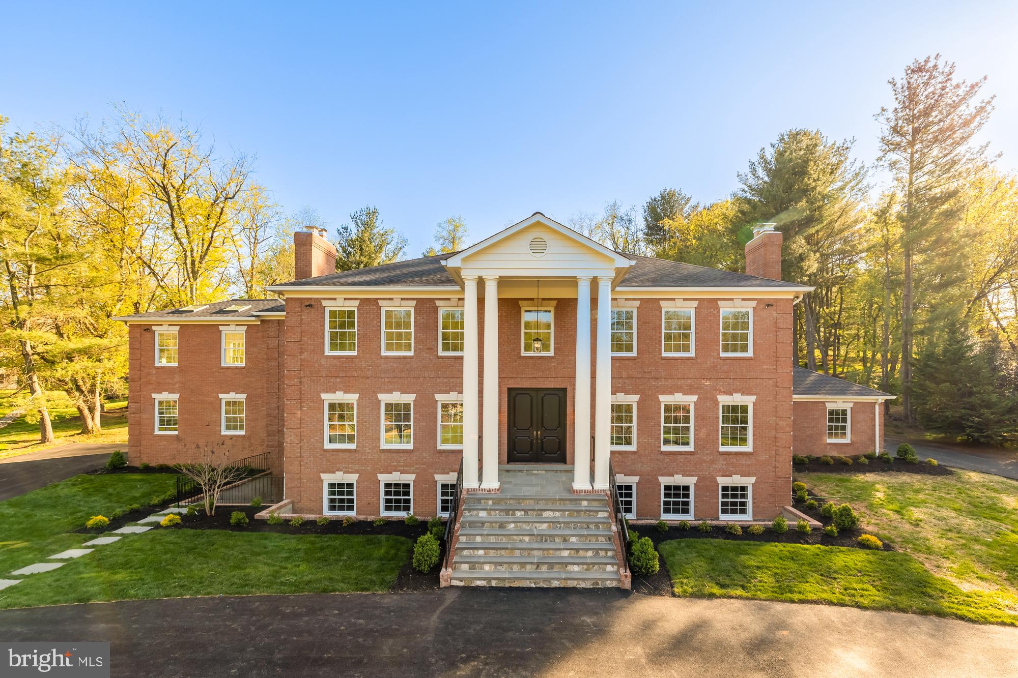 Set on two acres of landscaped grounds—masterfully designed by an award-winning landscape architect—this 9,000+ sq. ft. Georgian mansion seamlessly blends classic architecture with contemporary elegance.
Originally built in 1985 and completely renovated in 2025, this estate offers a rare combination of historical grandeur and modern luxury, with cutting-edge smart-home features integrated throughout.
The expansive outdoor setting includes a grand front lawn with a long circular driveway lined with trees, a stone fireplace and patio surrounded by flowering plants that sit as the centerpiece for the rear yard, and an additional inviting fire pit getaway perched up above the roof line for fantastic views. The expansive rear yard is thoughtfully designed to accommodate a future pool—an entertainer's dream.
Inside, the home is all about details and amenities, with every room thoughtfully curated for a discerning buyer. It exemplifies class and elegance with ornate moldings, handpicked imported lighting fixtures, and a functional layout. The estate features 6 bedrooms, 5 full bathrooms, 1 powder room, and 5 wood-burning fireplaces, creating an atmosphere of warmth and timeless charm.
The fully reimagined kitchen is a showpiece, boasting custom German-imported cabinetry complemented by Taj Mahal quartzite countertops, a butler’s pantry, and a separate back-of-house kitchen ideal for entertaining at scale.
A stunning main-level study is wrapped in rich navy Farrow & Ball paint and includes a custom wet bar with handmade brass/glass shelving and a unique one-of-a-kind colorful quartzite top—equally suited for work, leisure, or entertaining.
The luxurious 1,500-sq.-ft. primary suite includes a private sitting room or office, a fireplace, dual walk-in closets, and a spa-quality bath with radiant heat floors and an oversized steam shower.
The walk-out lower level is filled with natural light and offers a large rec room with a fireplace, a guest bedroom with separate entrance and patio, a home gym, and a wine cellar with room for over 1,000 bottles.
Conveniently located within walking distance to Potomac Village, top-ranked public and private schools, and just minutes from downtown Bethesda and D.C., this timeless estate is ready for its next chapter.