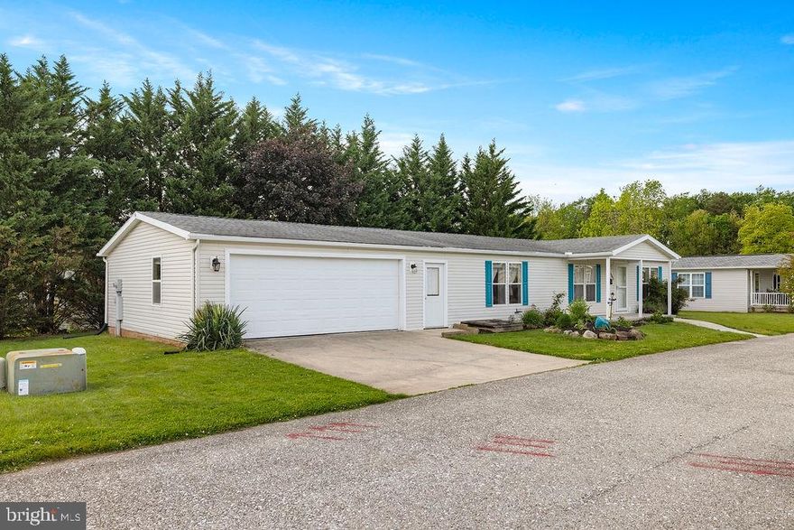 Super For Seniors, well-kept 55+ community with a peaceful setting.  Two car oversized attached garage along with a fantastic sunroom.  Sunroom has A/C and heat.  This home is ready for immediate occupancy and is clean....   Three bedrooms with 2 full baths, built on a block foundation with crawl space.  Schedule a showing today.