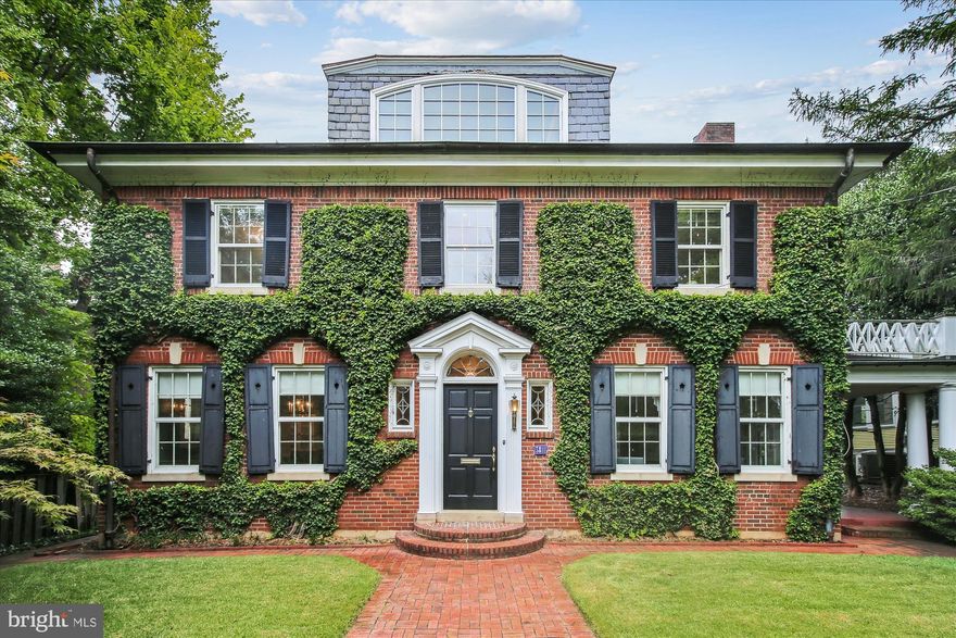 This gracious estate nestled between Observatory Circle and Cathedral Heights features 3,000+ finished square feet of living above grade. Sunshine abounds in every room. The welcome begins in the spacious foyer. To one side, there is a large living room, which includes a wood-burning fireplace and access to the portico. To the other side, a dining room offers ample space for feasts of all sizes, and is flanked by a butler's pantry. The kitchen is punctuated with Corian and granite counters, an island with a rinsing sink, an ice maker and Sub-Zero fridge. On the other side of the pass-through is a sunny breakfast nook for less formal dining, and a sunroom. Level 2 features a spacious primary suite with a dressing room and en-suite bathroom, plus three bedrooms of ample size and a hallway bathroom. A laundry closet is also found on this level. Level 3 features the loft / fifth bedroom, a bathroom and a balcony with views of National Cathedral. A dry sauna is located in the basement, along with a full bathroom, but is largely unfinished - perfect for additional storage. A detached carriage house fits two cars and more. The grounds boast of brick walkways, manicured lawns and a brick patio, in addition to mature shrubbery and trees. Make this stunning home your next #UrbanCastle!