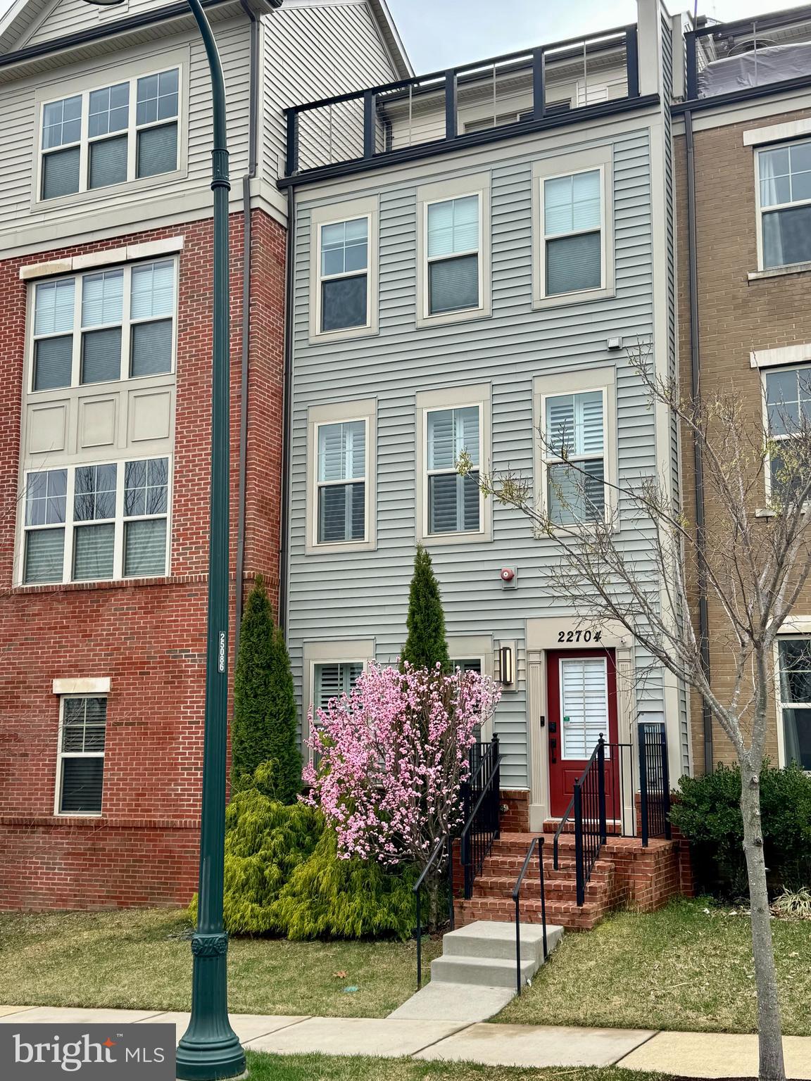 Welcome to this exceptional four-level former model home in the sought-after Cabin Branch neighborhood of Clarksburg, MD. Designed for modern living, this residence features engineered hardwood floors throughout, fresh Sherwin-Williams paint, and a bright, open floor plan that seamlessly connects the living spaces. The expansive, upgraded kitchen is a chef’s delight, boasting a massive island, granite countertops, upgraded stainless steel appliances, tile backsplash, recessed lighting, and a sink built into the island for added convenience. The kitchen seamlessly flows into a spacious family room and opens onto a large back deck, ideal for outdoor dining and entertaining.
Enjoy flexible living with a 1st-level bedroom ideal for guests or a home office, and take in scenic views from the front rooftop terrace overlooking a wooded conservancy. The home is equipped with dual-zone HVAC, a smart Samsung dual washer and dryer, energy-efficient plantation shutters on the first two levels, and blackout top-down honeycomb shades on the upper levels. The double-insulated garage door and energy-saving features make this home approximately 40% more efficient than standard energy-efficient homes and over 100% more efficient than an average home, according to the Potomac Edison Home Energy Report for this property.
Additional highlights include a rough-in for an optional half bath on the first floor, a two-car garage with double driveway parking, and access to community amenities such as covered pavilions, playgrounds, open fields, and scenic walking trails. Conveniently located near Clarksburg Premium Outlets, dining, parks, and with easy access to Route 270, this home offers the perfect blend of style, functionality, and energy efficiency in a vibrant community setting.
*Mortgage savings may be available for buyers of this listing