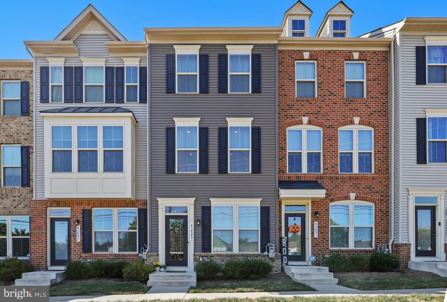 Welcome home!! This 4 level townhome is what you've been waiting for! Nestled in the heart of Central Ashburn, close to WO&D Trail, you couldn't ask for a better location. Enter the first level foyer off the 2 car garage with tons of storage space! Head upstairs to the open dining, kitchen, and living room with a spacious deck off the back of the home with large sliding glass doors that let in beautiful natural light! Upgraded kitchen cabinets, countertops, and stainless steel appliances have this gourmet kitchen and large island calling out to you! Head upstairs to check out all the spacious bedrooms including an oversized primary suite with wood floors throughout the bedroom level! Don't stop there - head up to the 4th level guest suite with an en suite full bath, massive walk-in closet, and rooftop terrace. This home has it all and won't last, don't miss out and schedule a showing today! Short distance to dining and shopping! Close to 7 and 267 for easy commuting!