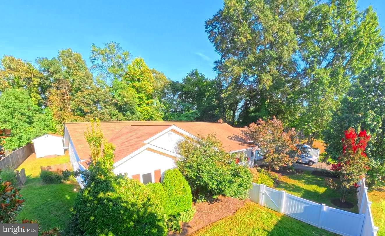 LOCATION *LOCATION * LOCATION
Welcome to 214-b Washington Ave, La Plata MD 20646.
Step into comfort, convenience and character with this beautifully maintained three-bedroom, two bath Rambler nestled on a peaceful, private, and level 0.78-acre lot situated in the heart of La Plata. Enjoy everything that La Plata has to offer (restaurants, shopping, theater, schools, the farmers market and so much more).
With nearly 2,000 sf of finished single level living, this home offers the best of both worlds: cozy charm and thoughtful updates. Whether you're entertaining on the large back deck, soaking in the hot tub under the stars, or curling up by the wood-burning stove on a chilly evening, every corner invites you to relax and feel at home.
Inside features:
There's a spacious eat-in kitchen with updated appliances, stylish black-and-white tile flooring.
Just off the kitchen is the mudroom with full sized washer and dryer and a stand-up freezer (all covey).
All 3 bedrooms are generously sized. The owner's suite has direct access to the rear deck, and the bathroom features a large soaking tub that sits under one of the 3 skylights in the house. More still, there is an over-sized tiled shower and a large vanity with ample storage. There are gleaming hardwood floors and ceiling fans throughout the house.
Outside living features:
The 0.78-acre lot is also fenced (front and back yard) adding to the privacy and security and fun factor for the kids. The rear deck has access at 3 points from the house making easy access for guest when you're entertaining. Also tucked into a corner of the back yard is a large (12x24) Omish type shed.
The house also has an attached 2 car+ garage that features built-in shelving and both garage doors have remote openers. The finished breezeway has access from the front of the house and can be used for office or flex space. The front covered porch will welcome guest access to the house without being in the weather. Come see this beauty for yourself. It's worth the look.