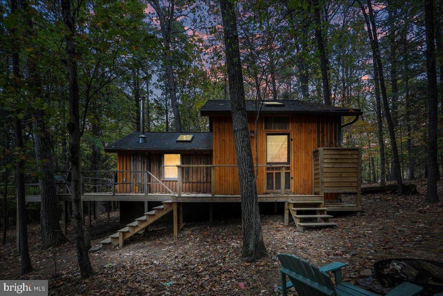 OFFER DEADLINE October 20th, 5pm. Seller has the right to accept offer before deadline. 


Welcome to your dream getaway cabin in Berkeley Springs! This adorable home is the perfect place to escape the stress of work and step into a world of tranquility. Surround yourself with the beauty of nature and peace. Step inside to find a wood stove, perfect for cozy winter days. The upstairs loft  is the perfect place for kids or guests to stay.  The outdoor wraparound deck is an ideal place to enjoy your morning coffee or for family dinners in the evening. Notice the view of the creek  from the deck.  Take a stroll down to the landing for a closer look or to go for a dip! Don't forget to check out the incredible outdoor shower! This home is truly a gem. Act now before it's gone.