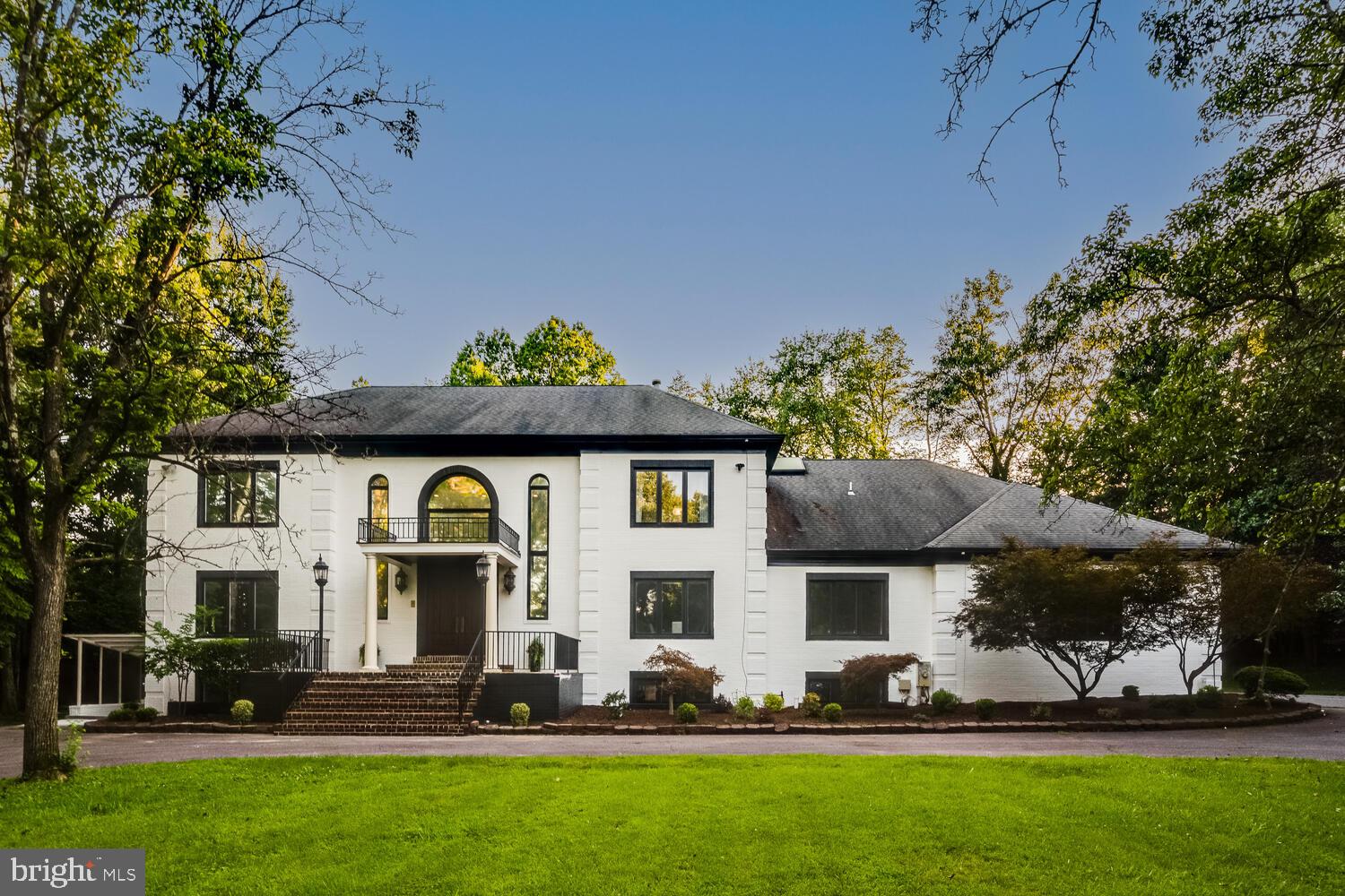 Branching off Bells Mill Road, a private drive discreetly winds to a gated entrance in the heart of prestigious Potomac. The circular motor court upon which sits a sophisticated estate home, is fully fenced and nestled behind mature landscaping that keeps the home hidden from the street. The home’s sophisticated, modern exterior is a preview of the comprehensively updated and thoughtfully designed interior. A true manor of luxury.
--
Beyond the grand double doors and oversized front terrace, is a bespoke two-story entry with two flanking grand staircases, a cascading crystal chandelier and marble floors. Perfectly symmetrical, the home evokes cues from classic estates of the past. On either side of the central entry hall are generously proportioned formal rooms. The modern living room flows nicely into the private main-level office with custom mahogany built-ins and direct access to the back patio. The embassy sized dining room gives way to the light filled open concept kitchen and family room with striking stone fireplace.
--
The eat-in, gourmet kitchen was fully reimagined and updated in 2020 to have unobstructed sightlines to the family room and backyard, as well as top of the line appliances, oversized island, beverage bar and pantry. The main level even has a beautifully proportioned bedroom with ensuite bathroom and walk-in closet. Plus, custom built mudroom with main floor laundry with easy access to the four-car garage.
--
Ascend to the upper level via the back stairwell or the main entry to discover the primary retreat, which is opulently appointed with a fireplace, large closets and dressing room. The lavish ensuite bath features a walk-in steam shower, freestanding tub, sauna, water closet, double vanities, vaulted ceilings, and skylights. Three secondary bedrooms complete the upper level. Each bedroom is generously sized with fully updated ensuite bathrooms and walk-in closets.
--
The lower level sits above ground allowing for amble natural light. The great room is equipped with surround sound and fireplace. Guest bedroom with ensuite bathroom and walk-in closets is complemented by two other bedrooms/dens. The cutest kids' playroom is tucked away from the French door lined recreation room. Lower-level laundry and exercise room as well as ample storage complete this level.
--
Combining both privacy and accessibility, 9118 Bells Mill Road is minutes away from top rated schools, downtown Potomac and world class restaurants and shopping. This all-brick home with 4-car garage sits on 0.92 acres with a flat, lush backyard and is ready for a pool and endless summer memories to come.
--
This manor of luxury exudes a modern all-brick exterior that matches its magnificently updated interior. And it’s ready for its next stewards…will it be you?
--
Key Updates:
Exterior painting (2025), brick repointing (2025), gazebo (2024), grill gas hookup (2024), primary bedroom closet update (2024), sump pump replacement (2024), primary bathroom and upper level bathrooms all updated (2023), main floor laundry/mudroom update (2023), LG washer and dryer (2023), LVP flooring installed in basement (2022), main and lower level bathrooms updated (2022), hardwood floors refinished (2021), 2-zone HVAC (2020), high-end kitchen appliances (2020), complete kitchen update to create open concept living-dining (2020), surround sound theatre speakers installed in lower level great room surround sound installed (2020), grand foyer update and coat closet built (2020)