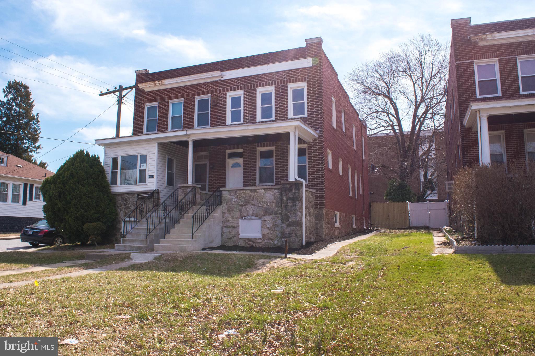 Beautifully renovated house with gleaming HW floors. Tons of natural light in this end unit. Large back yard for entertaining! Covered front porch to relax after a long day. This is a must see! Close to all that you need!