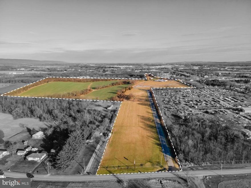 Opportunities are endless with this nearly 60-acre property in Middlesex Township.  Approximately 30 acres currently farmed with remaining acreage (27 acres +/-) used for recreational purposes as "picnic grounds" by a local fraternal club.  The buildings include a 6,630 SF block social hall with commercial kitchen and restrooms; metal pole building 1,500 SF; three pavilions; large BBQ pit; storage garages; 17 fenced horseshoe pits with clubhouse.  Property is served by a well and holding tank.  Potential to extend public sewer to site.  Zoning (Residential Farm) allows single-family dwellings (60,000 sf min. lot size),  agricultural uses, public and municipal uses, schools, recreational uses, parks, commercial kennels, commercial equestrian use, farm equipment sales/service, church uses, and more.  Property has long, paved entrance driveway from Wolfs Bridge Road.  Ideal for development, outdoor recreation, church camp, venue, or use by a private organization!