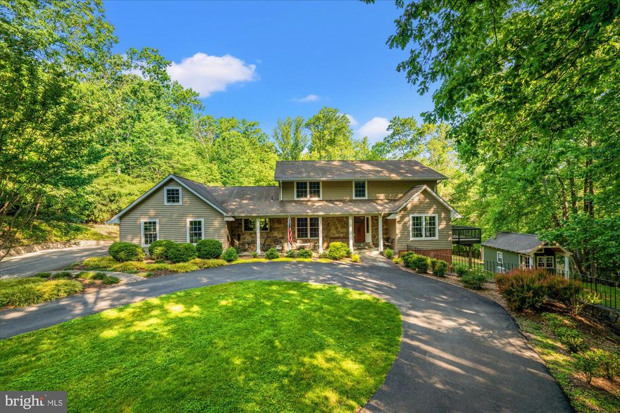 Welcome to 8112 Vista Point Ln, a stunning, nearly 4,500 square foot residence nestled in the serene and sought-after community of Fairfax Station, VA on a 5-acre estate. This rare property offers a blend of elegance & comfort, perfectly situated in a natural wooded setting with private bridle/hiking trails, three creeks & near total privacy. It’s truly a private natural oasis and a warm and inviting home.

The home features a light filled floor plan, 5 spacious bedrooms (including two primary suites) & 4.5 well-appointed bathrooms. The open kitchen is a cook's delight, boasting stainless steel appliances, including built in wall oven, & ample counter space that seamlessly flows into the living areas adorned with beautiful hardwood floors. Enjoy cozy evenings by the warmth of two fireplaces (gas + cast iron wood stove) that add charm & ambiance to this incredible home.

The finished, walk-out lower level, with its 11-foot ceilings, offers additional living space, perfect for a media room and a recreational area that lead to a slate patio. The top-floor suite is a retreat of its own, providing a tranquil space to unwind. The first-floor suite is perfect for guests or owners. Step outside to discover two large nearly new decks, ideal for outdoor gatherings, morning coffee or simply enjoying the peaceful surroundings.

Additional features include a two-car garage with a large, floored attic, a new whole house generator, and a new custom-built Amish outdoor home office studio, catering to all your practical needs. The property is equipped with a top-of-the-line new water purification system & elegant touches such as hardwood flooring, crown molding, recessed lighting, & multiple sliding glass doors that enhance the home's sophisticated appeal.

This property is not just a home – it's a lifestyle. Experience the perfect balance of privacy and community, with easy access to local amenities and the vibrant offerings of Fairfax Station, Clifton and Burke. Don't miss the opportunity to make 8112 Vista Point Lane your new address. Also: You can keep the chickens if you wish! Or the owners will take them with them.