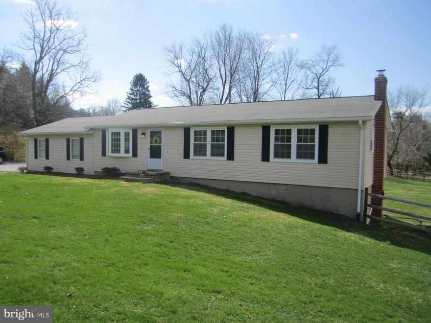 Charming  rancher situated on corner lot.Spacious bright updated kitchen with new cabinets,granite counter tops and SS appliances.Other updates include new windows,carpet on main level, heat pump,water treatment system,chimney liner,gutters,fenced back yard,and composite deck.Finished LL with bar, wood stove,stone wall and hearth.2 car attached garage and 1 car detached.Sound system in LL conveys