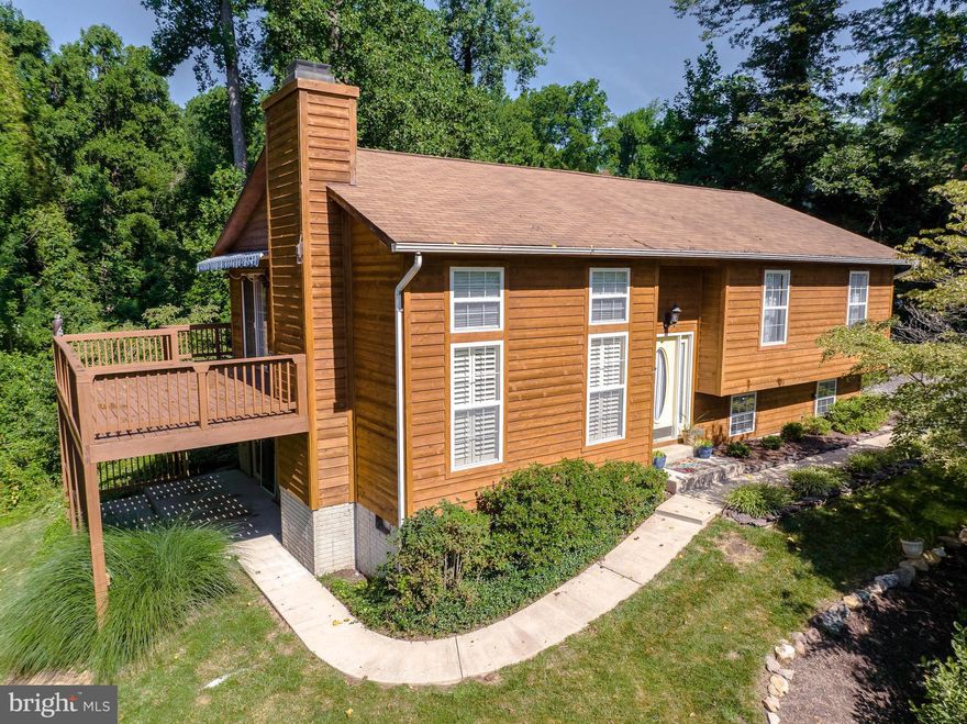 Beautiful home in The Willows, a private Bay front community with private beach and water access!!!!! 
Exterior: Cedar sided exterior with deck and patio and large widened driveway and small fenced rear area with shed.  Interior: Home is move-in ready with a unique open interior high ceiling floor plan. Large family room with floor to ceiling windows and gorgeous plantation shutters open to gourmet eat-in kitchen above...all freshly painted! 3 bedrooms upstairs with two full bath and skylights make for beautiful natural light throughout the upper level.  Finished 4th bedroom/den with large closet and full bath downstairs as well as storage and utility are with lower level entrance.  New HVAC as of 7/8/2022 and whole house humidifier!!!!