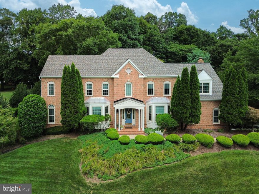 Nestled in the desirable Donovans Ridge community, this exquisite 5-bedroom, 4.5-bath home has been beautifully renovated and is situated on a tranquil .85-acre lot. Extensive landscaping and hardscapes, surrounded by majestic trees, provide ultimate privacy. The stately brick façade, 2-car side-loading garage, and natural stone walking path to an expansive green space create an inviting exterior. Inside, an open floor plan, soaring ceilings, decorative moldings, and an abundance of glass seamlessly unite indoor and outdoor spaces.

Upon entering, warm hardwood floors greet you in the grand 2-story foyer, ushering you into the formal living room where natural light illuminates the beautiful space. This space opens to the piano room/sunroom with a high ceiling and walls of arched windows. The adjoining dining room, accented by a bay window and trendy wallpaper, complements the home's architecture. The gourmet kitchen features stainless steel appliances, including double wall ovens, and an oversized granite center island with a gas cooktop that provides additional workspace and bar seating. The sun-filled breakfast room, with an upgraded Anderson energy efficient sliding door and transom window, grants access to the freshly painted deck and stone walkway leading to the green space.

The 2-story family room beckons with a vaulted ceiling, skylights, a ceiling fan, and a floor-to-ceiling brick wood burning fireplace flanked by arched windows. A library with custom built-ins makes a perfect home office, and a lovely powder room and laundry room/mudroom completes the main level. Don’t miss the jacuzzi sink in the laundry, perfect for handwashing delicate garments. Ascend the stairs to the foyer and family room overlook, leading to the gracious owner's suite. This retreat features plush carpeting, walls of windows, a large walk-in closet, and a separate sitting room. The luxurious remodeled bath boasts a comfort-height quartz-topped dual-sink vanity, a claw-foot soaking tub, and a frameless glass shower. Four additional bright and cheery bedrooms, with ample closet space, and two beautiful full baths complete the upper level.

** Upgrades include built-in shades, upgraded doors, custom finishes, and a sprinkler system for the landscaping. The home also features an upgraded HVAC systems, enhanced insulation, a NEW roof and skylights, and upgraded triple pane high efficiency windows. Garage shelving for keeping you organized.  Additionally, an upgraded security system, a storage shed, and an upgraded portico enhance the home's functionality and security

The finished basement is perfect for entertaining or a cozy movie night in by the fireplace, offering another bedroom (non-conforming) option. Additionally, there is another room that is perfect for a home gym or work space featuring hardwood floors, and ample storage  space with shelving  plus a full length cedar closet. 

All this awaits you in a tranquil setting with easy access to the Fairfax County Parkway, Braddock Road, and Route 123. Burke Town Center provides all the daily necessities, or you can enjoy charming cafes and boutiques in the nearby historic town of Clifton. The surrounding area offers stunning parkland, fine golf courses, wineries, and leisure activities. This is the perfect home in a fantastic location!