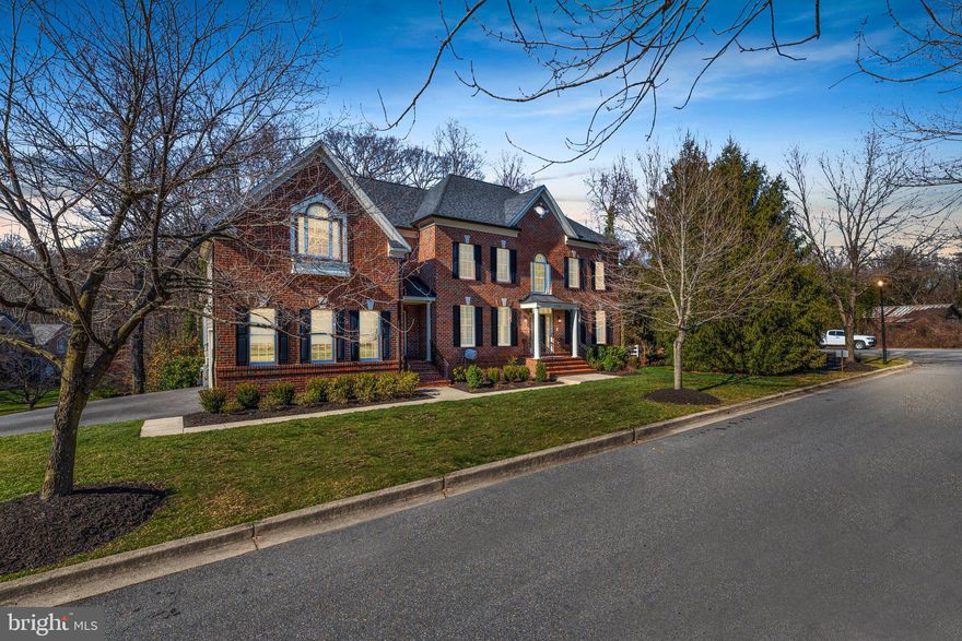 Welcome to 1200 Mansion Woods Rd, a luxurious retreat in the Vineyards at Iglehart! Situated on 1.4 acres, this stunning property offers a perfect blend of elegance, comfort, and convenience.

As you step inside, you'll be greeted by a grand two-story foyer that sets the tone throughout the home. To your right, a cozy sitting room, while a formal dining room on your left provides an exquisite setting for gatherings. Off the dining room, discover a custom butler's pantry featuring a wine fridge. This entry seamlessly transitions into a fully remodeled gourmet kitchen. Here, you'll be greeted by a 10-foot island, updated appliances, including a Wolf 5 burner cooktop. The pantry closet offers additional storage, ensuring all your culinary needs are met.

The heart of the home awaits in the two-story family room. Filled with natural light and accented with built-in shelving and a gas fireplace, creating the perfect ambiance for memorable gatherings. Completing the main level are an office space, powder room, and a convenient mudroom located off the attached 2-car garage.

Upstairs, the wide plank hardwood floors guide you through the primary bedroom suite, your private sanctuary. This spacious retreat includes an office/sitting room, built-ins, and two walk-in closets. Indulge in luxury within the recently renovated en-suite (renovated in 2024), featuring a freestanding tub, frameless shower, and double vanity, all adorned with luxurious finishes.

The fully finished basement offers endless possibilities for entertainment and relaxation. Discover a fifth bedroom and fourth full bathroom, along with a custom wet bar featuring an industrial beverage fridge and large island with bench seating. Enjoy movie nights in the private theater room equipped with eight recliner chairs. There's an additional bonus room used as the exercise room.

Step outside to your own outdoor oasis, featuring a large screened-in patio, concrete slab with a basketball half court, and a fire pit area perfect for gathering under the stars. Additionally, there's an outdoor shed for all your storage needs.

Conveniently located with easy access to Route 50 and 97, this property offers the best of both worlds – a serene retreat just minutes from downtown Annapolis. Don't miss your chance to experience this wonderful home!