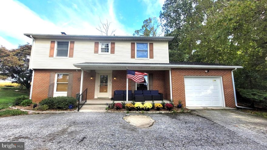 Welcome to 1815 Manchester Rd, a quiet place to call home.  This home qualifies for USDA Financing.  Buy with 0% down payment for qualified buyers. This solid 4BR, 3.5 BA colonial with one car garage is situated on a .55 acre lot offering riding trails and plenty of space for outdoor fun. Inside you'll be greeted by a center staircase.  Prepare and serve delicious meals in the open spacious kitchen and dining room. The kitchen features stainless steel appliances, updated cabinets, quartz countertops and a generous island for family gatherings.  The family room offers a cozy wood burning fireplace to enjoy cooler nights and easy access to the full bath with walk-in shower. Get laundry done without all the stairs with the convenient main level laundry room which has a rough-in for a hall bath.  On the upper level you will find beautiful gleaming hardwood floors and 4 spacious bedrooms with abundant closets and full bath. The owner's suite includes an updated private full bath with walk-in shower.  Design and create your own space in the unfinished basement which includes a half bath.  Got allergies - no problem, no carpet here. The backyard features 2 gazebos, a playset and storage shed.  Improvements include roof 2015, water heater 2018, well pressure tank 2019, heat pump 2016, well 2016, kitchen updated 2021. The garage has been recently insulated, drywalled and new insulated garage door with remote. The circular driveway provides additional parking for guests.  This home offers the perfect balance of rural living just a short distance from all the conveniences you need.