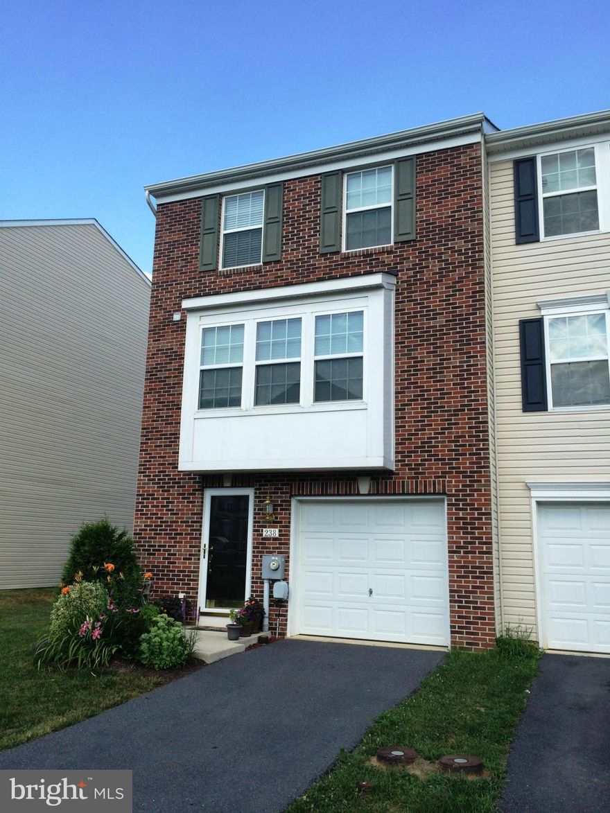 3 level Brick front End Unit  Garage Townhouse. Why wait to build! This end unit has an 8 ft. sunroom expanded plan for 2032 finished sq.ft.!  Sunroom creates a huge open kitchen with island & upgrade cabinets & appliances. The master suite 13X18 w/ deluxe bath w/ soaking tub, big shower & dual vanity. 2 unfinished lower level rooms & walkout! New Harman Accentra pellet stove conveys and more!