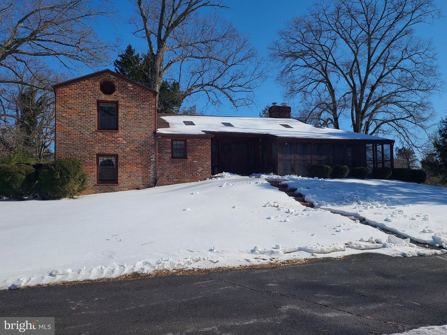 Just a short drive from the Center of the town of Madison.  Come home to this spacious one-of-a-kind brick split level home on 4.5 acres is filled with lots character and charm. Enter through gorgeous Brazilian Mahogany double doors framed with custom stained glass into a beautiful large ceramic tiled foyer. The main level includes spacious rooms with multiple skylights filling them with natural heat and light. Hardwood floors, a separate dining room, and wood burning fireplace in the living room for those cold winter evenings or enjoy the screened porch with a good book, music or just private time. Just a few steps to the upper level which has 2 bedrooms with built in closets with shelves, hardwood floors, and a full bathroom, and you could certainly make this a primary suite with an office and a primary bath.  Directly below are 2 additional bedrooms, a second full bathroom and half bath, and a convenient kitchenette. The basement is finished to include a large recreation/family room with a brick wood burning fireplace, spacious office/hobby room, a 3rd full bathroom, and laundry room. Entertain outside to enjoy the pristine landscaping, a walk around the pond, and even enjoy a bbq on the outdoor brick fireplace. You'll also find the detached 2 car garage as well as an additional 10x40 storage building/shop. Comcast Xfinity high speed internet is here! Call me for a tour.