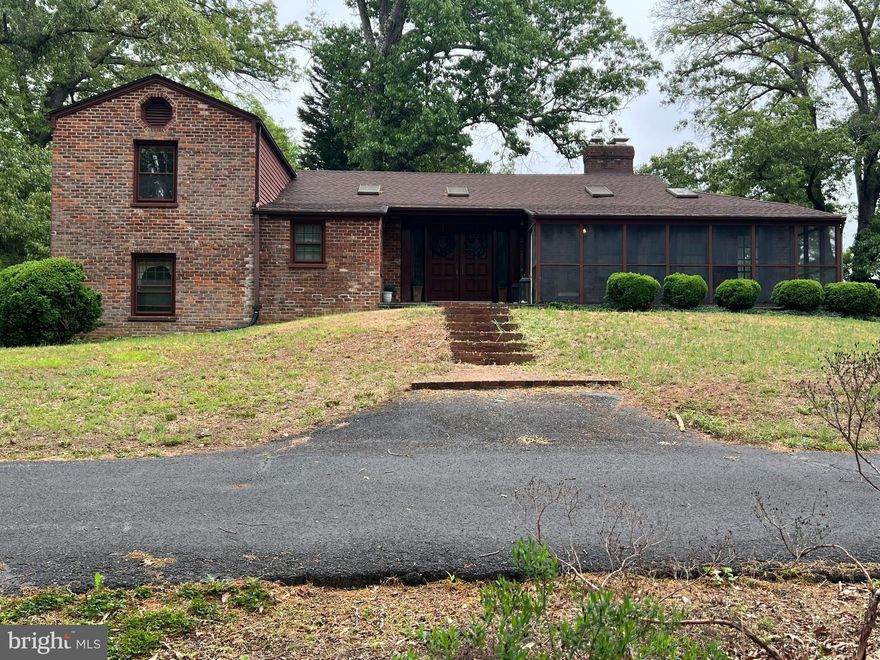 Public Open House Sunday May 3, 2026.  There will be refreshments and Drawings for some prizes.  Please Join us!

Just a short drive from the Center of the town of Madison.  Come home to this spacious one-of-a-kind brick split level home on 4.5 acres is filled with lots character and charm. Enter through gorgeous Brazilian Mahogany double doors framed with custom stained glass into a beautiful large ceramic tiled foyer. The main level includes spacious rooms with multiple skylights filling them with natural heat and light. Hardwood floors, a separate dining room, and wood burning fireplace in the living room for those cold winter evenings or enjoy the screened porch with a good book, music or just private time. Just a few steps to the upper level which has 2 bedrooms with built in closets with shelves, hardwood floors, and a full bathroom, and you could certainly make this a primary suite with an office and a primary bath.  Directly below are 2 additional bedrooms, a second full bathroom and half bath, and a convenient kitchenette. The basement is finished to include a large recreation/family room with a brick wood burning fireplace, spacious office/hobby room, a 3rd full bathroom, and laundry room. Entertain outside to enjoy the pristine landscaping, a walk around the pond, and even enjoy a bbq on the outdoor brick fireplace. You'll also find the detached 2 car garage as well as an additional 10x40 storage building/shop. Bring your pet sitting here, there is also a Climate Controlled 8-unit Kennel.  Comcast Xfinity high speed internet is here! Call me for a tour.