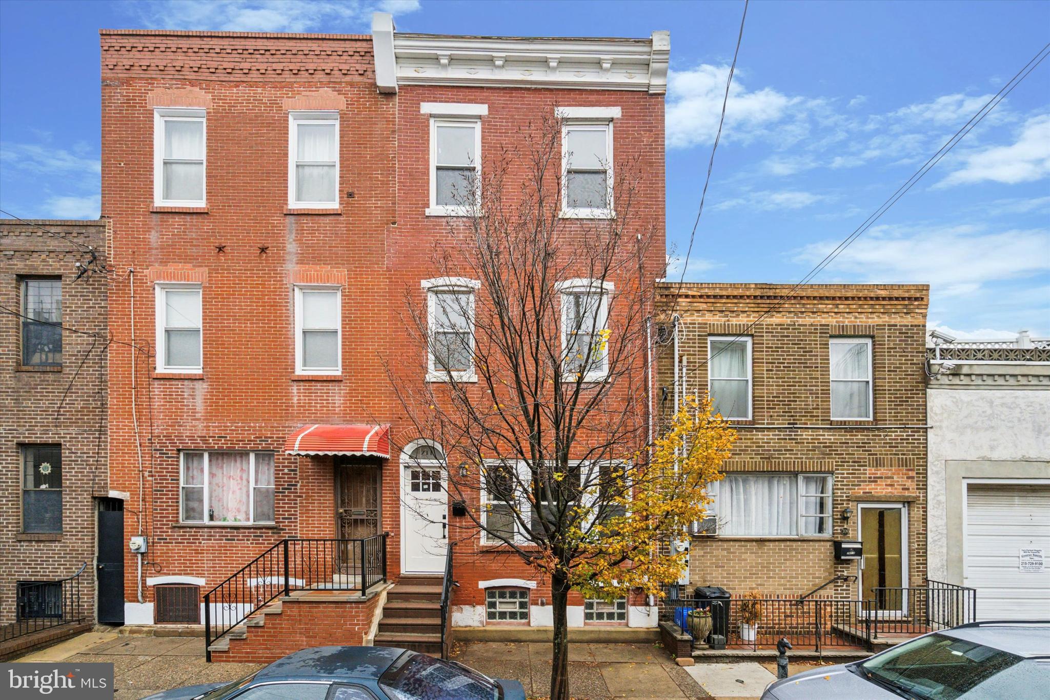 The two hardest qualities to find in a Philadelphia house are size and location, and 711 Reed has both! Located in Passyunk Square, directly across from Fitness Works and two blocks from The Avenue, this over 2,000 sq foot, 6 bedroom home is filled with all of the essentials a growing family could need. Elevated several steps off of the street level, you immediately walk into a large, open living/dining/kitchen first floor, including bar seating, a large, south facing (light!) front window, and a powder room. Ascending up to the 2nd floor, you'll find a massive front bedroom, along with a full bath, and two connected bedrooms/office rooms, Continuing up to the 3rd floor, are three additional bedrooms, all with great natural light and size, along with an additional full bath. Basement is full-sized with high-joists, perfect for finishing. Owner has had all mechanicals and roof redone within the past several years, along with new flooring installed throughout. The SEPTA 47 bus runs up and down 7th and 8th Streets for easy access to Center City and South Philly. Capitolo, Goldstar, Columbus, Jefferson, and Dickinson parks are all within a few minute walk.