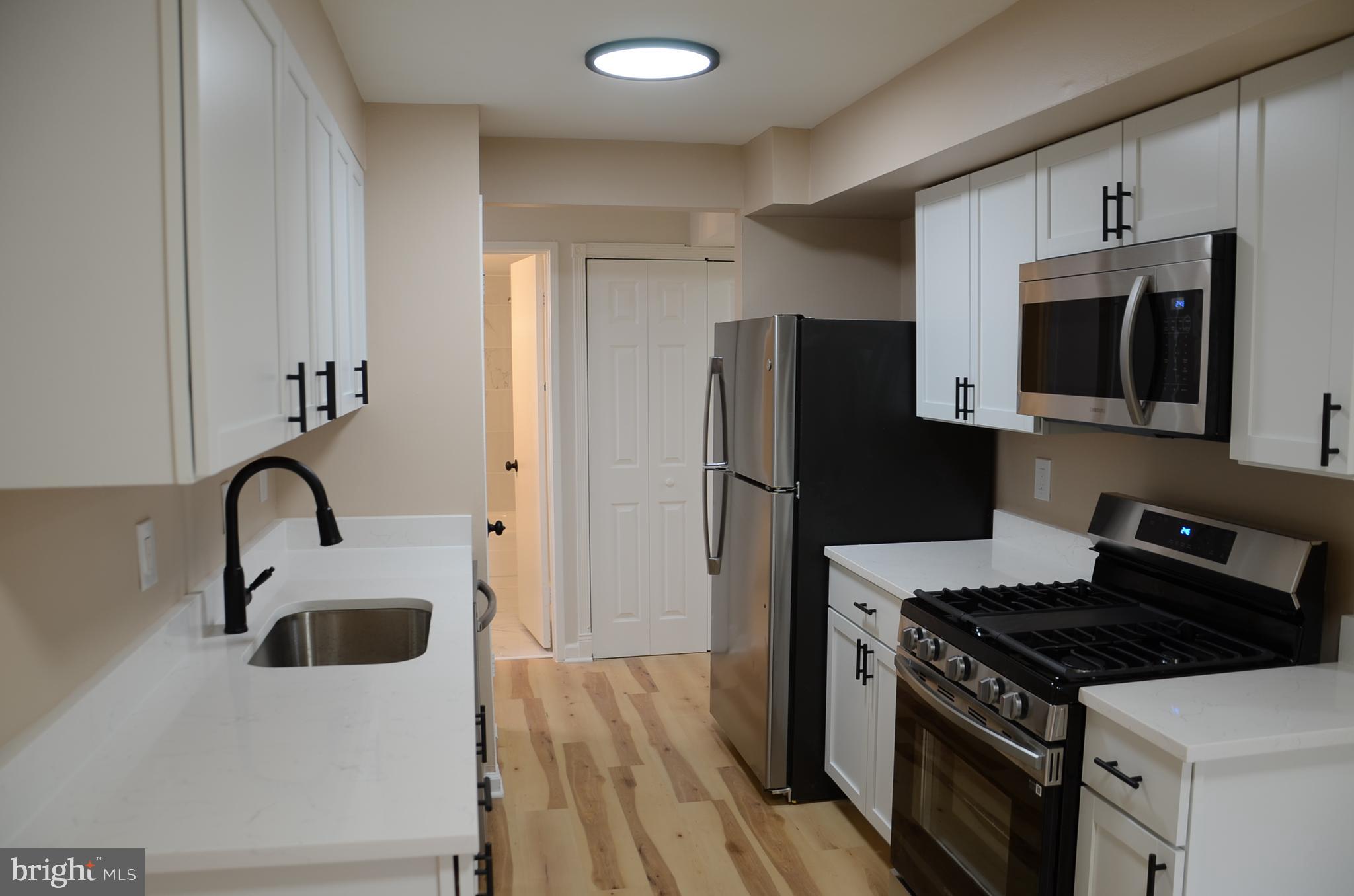 Spacious remodeled 2 Bedroom + 1 Large enclosed den. All new flooring in the entire unit, new recess lights, switches and outlets, recent electrical panel upgrade, recent 3 glass sliding door. Crown molding and a wood burning fireplace in the large family room leading to the balcony with outside storage as well. Brand new kitchen with custom quartz counters, shakers cabinets and all new SS appliances. Many more upgrades, come and see for yourself and fall in love with this unit. Condo fee includes electric, gas, water and home owner's insurance. Near highways, bus stops and a convenient walk to the shopping center. 2 permit parking spaces and a beautiful well maintained community pool. Washer and dryer in the building.