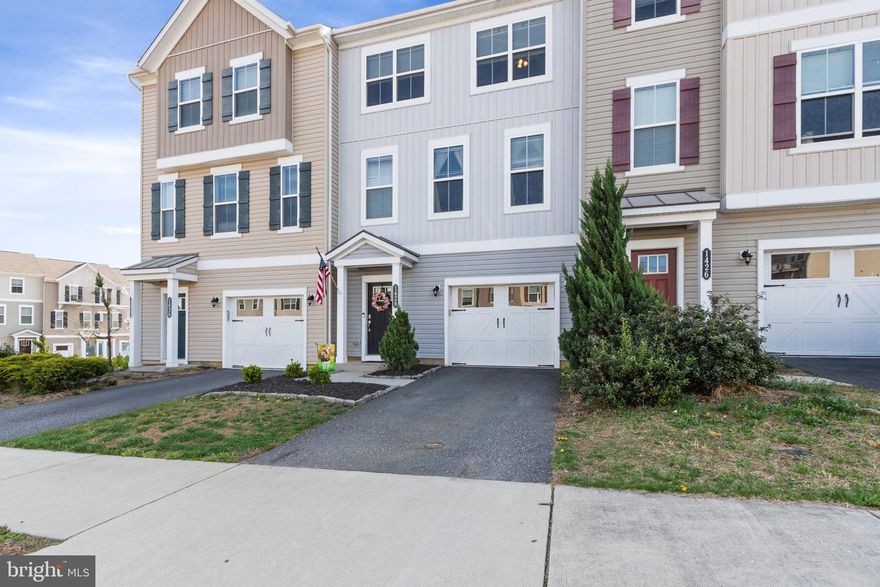Welcome to 1428 Hudgins Farm Circle - Where every detail has been thoughtfully considered!  From the moment you step inside, this stunning three-level townhome in the popular Summerfield community captivates with timeless charm, modern vibes, and a layout perfectly designed for the way you live today. Move-in ready and meticulously maintained, this is the one you've been waiting for!  The ENTRY LEVEL sets the tone with gleaming hardwood floors that guide you into a versatile Bonus Room — ideal as a home office, recreation room, fitness studio, or playroom. A potential Bathroom exists on this level with a rough-in. Step directly outside to your fully fenced (vinyl =easy maintenance) private yard, or into the attached garage for effortless everyday living. Head up the recently- installed hardwood staircase to the Main Level.  The MAIN LEVEL is where you'll truly fall in love. Also finished with recently- installed hardwood flooring, this area is bright, open, and beautifully appointed.  The expansive Living Room offers endless possibilities for entertaining and relaxing in style. A charming bump-out nook adapts seamlessly as a formal Dining Room or home office area. The showstopping Kitchen is a chef's dream, featuring rich hardwood floors, stunning cabinetry, a central island, gleaming granite countertops, a pantry, stainless steel appliances (the microwave is new), and a generous Eat-In Area bathed in natural light. Step out onto the maintenance-free Composite Deck and savor your morning coffee overlooking serene common green space — with no rear neighbors, your privacy is unmatched. What a beautiful view overlooking 2 ponds! Over $17,000 in premium outdoor upgrades are already included, so you can simply move in and enjoy. A conveniently located Half Bath completes this exceptional level. The UPPER LEVEL is your personal retreat. The spacious Primary Suite impresses with a spacious large, walk-in closet and ceiling fan.  The spa-inspired En-Suite Bath soothes with elegant tile flooring, dual vanities, and a luxurious walk-in shower. The Laundry Room is smartly positioned on the bedroom level alongside two additional well-sized Bedrooms and a Full Bath — thoughtful design at every turn.  The savings don't stop there!  This home is Energy Star Certified, meaning lower utility bills from day one (Please as your agent to provide the info in the Document section of the MLS.). All window blinds and curtains convey with the home.  COMMUNITY/LOCATION: Life in Summerfield means access to scenic walking trails, a soccer field, tot lots, sidewalks, and a true sense of community. The location is simply unbeatable — minutes from Downtown Fredericksburg, I-95, Mary Washington University, top-rated hospitals, premier shopping, and the exciting FXBG Nationals stadium.  Schedule your private tour today and make 1428 Hudgins Farm Circle yours! Don't miss out!
