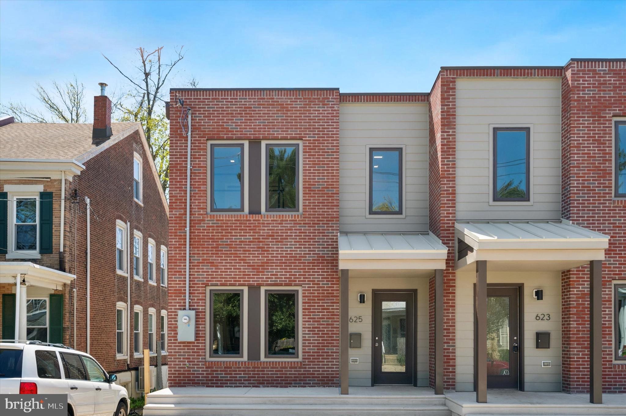 Welcome to 625 Shawmont Ave – a stunning brand-new construction home located in a prime Roxborough location. This impressive 4-bedroom, 3-full bath home offers high-end finishes, bright open spaces, and thoughtful design throughout. The main level features an open living room and a beautifully designed modern kitchen with sleek two-tone 42-inch cabinetry, stainless steel appliances, quartz countertops, and a large breakfast island with pendant lighting. A versatile first-floor bedroom is perfect for guests or a private home office. Sunlit interiors are highlighted by seamless open/close casement windows that flood every room with natural light. Spacious bedrooms offer ample closet space and modern ceiling fans for added comfort. Each of the three full bathrooms showcases contemporary elegance, featuring floating vanities, frameless LED-backlit mirrors, dual flush toilets, designer tile, and upscale fixtures. Fantastic features include luxury vinyl plank flooring, LED lighting, energy-efficient heating and cooling systems, convenient upper-floor laundry, and an oversized walkout deck with direct access to an expansive rear yard stretching over 160 feet. Additional highlights include a builder’s warranty and 10-year tax abatement for added peace of mind and long-term value. Ideally located just minutes from the shops and dining of Manayunk and Chestnut Hill, and steps to the Ivy Ridge Regional Rail station for an effortless commute to Center City. Outdoor enthusiasts will love the easy access to the scenic trails of Wissahickon Valley Park and the Schuylkill River, perfect for hiking, biking, and running.