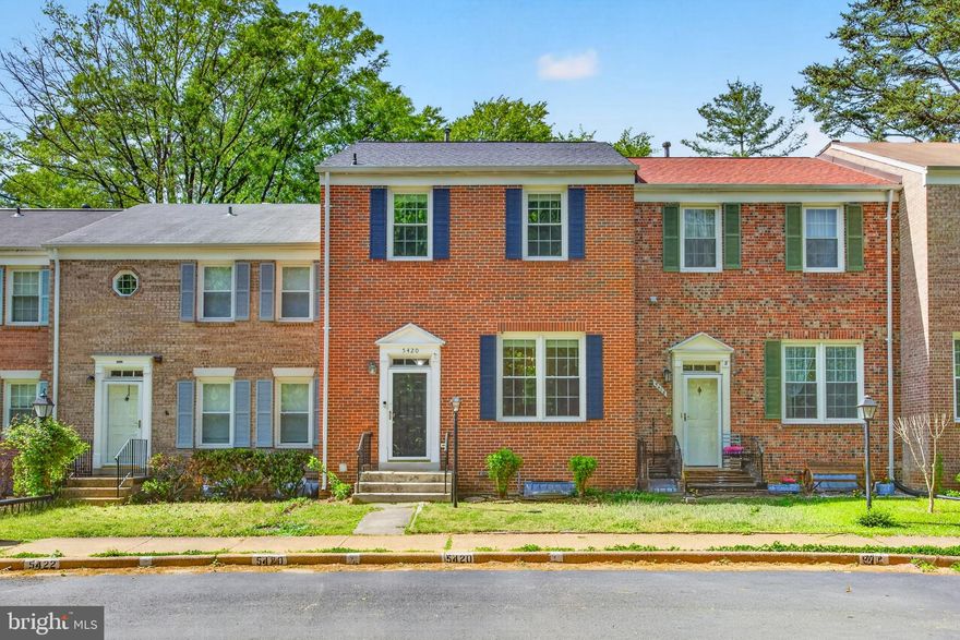 Welcome to 5420 Brixham Ct, a beautifully updated all brick townhome in the highly sought after Lake Braddock community, one of Burke’s most desirable neighborhoods. This 3 bedroom, 2 full and 1 half bath home offers a rare combination of space, light, and thoughtful updates throughout.

From the moment you enter, you’re welcomed by a sun filled main level featuring soaring ceilings, an open layout, and a rare two story family room that creates an airy, contemporary feel. The upgraded kitchen offers granite countertops, white cabinetry with ample storage, and flows seamlessly into the main living space, perfect for both everyday living and entertaining. Natural light fills the main level, creating a warm and inviting atmosphere.

Just off the living area, step out onto a large private deck, ideal for relaxing or hosting guests. Upstairs, the spacious primary suite, along with two additional bedrooms and a full bath, offers comfortable living space filled with natural light.

This home has been well maintained with numerous important upgrades. The roof, windows, and HVAC were updated around 2017. Additional improvements include a central HVAC dehumidifier added in 2025, masonry exterior work in 2025, sealed upper level windows for water protection in 2025, attic reinsulation in 2022, and cork flooring in the basement in 2018.

Located just one block from Lake Braddock Park and Lake Braddock Secondary School, this home offers exceptional convenience along with access to community amenities including pools, tennis and pickleball courts, playgrounds, walking trails, and a scenic lake. Residents enjoy a vibrant neighborhood with plenty of outdoor activities, recreational options, and a strong sense of community right outside their door.

Enjoy easy access to VRE, Metrobus to the Pentagon, I 495, and nearby shopping, dining, and parks including Burke Lake and Lake Accotink. With scenic trails, recreational amenities, and everyday conveniences just minutes away, this location offers a well balanced lifestyle that combines comfort, accessibility, and long term value.