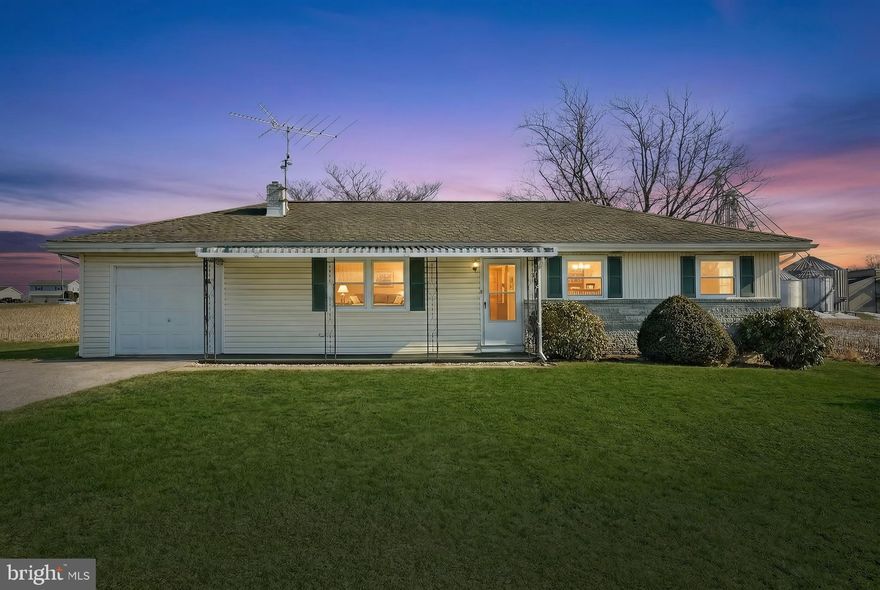 Welcome home to this charming, one-owner rancher nestled on a clear, level lot with room to breathe and space to grow!  Custom built for the original owners, this well-loved home is filled with potential and ready for its next chapter. Offering 3 bedrooms and 1 full bath, the layout includes a comfortable living room, a classic galley kitchen, and an adjoining dining room perfect for everyday meals or hosting family gatherings.  Enjoy your morning coffee on the inviting covered front porch, or unwind in the evenings on the covered back deck overlooking the yard. The attached one-car garage provides convenience, while the attic offers valuable additional storage space.  The partially finished lower level expands your options to finish it and add to living space, with a laundry room, utility room, and an additional garage area that could easily serve as a workshop, storage for yard equipment, or the perfect spot to tuck away a classic car. Outside, you’ll also find a storage shed and a covered parking area ideal for a boat or camper. If you’re looking for a property with character, space, and potential — this rancher is ready to welcome you home!