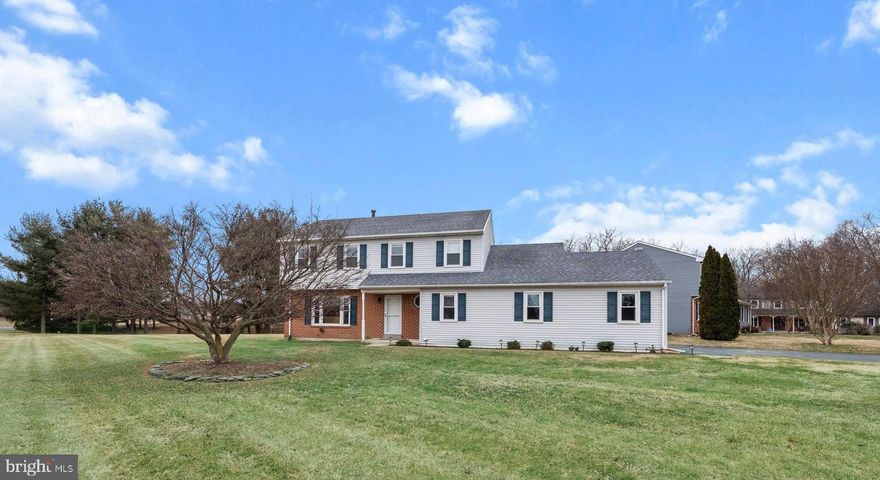 Welcome to this beautiful and spacious two-story Colonial offering 4 bedrooms, 3 newly renovated full baths, newly renovated kitchen, and a nicely updated lower level. Situated on a .75-acre corner lot in a quiet cul-de-sac, this home backs to tall pines and mature trees, providing a serene setting. Thoughtfully updated from top to bottom, the home blends elegance, comfort, and functionality with modern finishes designed for today’s lifestyle. The formal living room features large, picturesque windows and flows seamlessly into the dining room, creating an ideal space for both intimate gatherings and larger celebrations. The heart of the home is the newly renovated kitchen (2024) with a breakfast nook, showcasing upgraded 42-inch cabinetry, a tasteful tile backsplash, gorgeous granite countertops, 12x24 tile flooring, and sleek stainless steel appliances. The kitchen opens to a spacious family room, ensuring everyone is connected. Sliding doors from the family room lead to a flat backyard with a stunning expansive paver stone patio with a built-in firepit (2024), perfect for entertaining or relaxing while enjoying the peaceful surroundings. The main level also includes a newly renovated full bath with brand new glass shower doors, a laundry room, and a side-entry oversized two-car garage. Upstairs, the primary suite offers a large walk-in closet and a new en-suite bath featuring a marble-tiled shower, new vanity, new toilet, new tile flooring, and new fixtures. Three additional generously sized bedrooms share a beautifully renovated hall bath with double-sink vanities, marble surround, new fixtures, new toilet, and new tile flooring. The partially finished lower level has been updated (2024) with new ceilings, recess lights and flooring, making it ideal for a home office, recreation room, or additional living space. All three full bathrooms have been completely renovated (2024) with 12x24 tile flooring, marble tile shower and tub surrounds, new vanities, new toilet with non-electric bidet toilet seat, and new fixtures. Additional highlights include ceiling fan in each bedroom, new carpeting (2024) primary bedroom, stairs and hallway, some fresh paint, and more. This exceptional home is available only due to relocation and is truly move-in ready. Just unpack and enjoy.