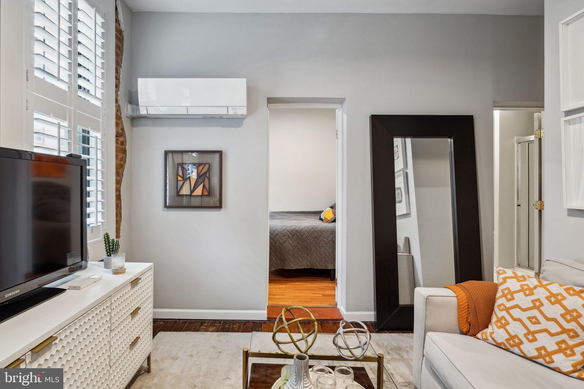 Available now! Located on one of the best blocks in Northern Liberties, the intersection of Poplar and American Streets, is this expansive corner property. Inside Unit C, beyond a vibey 5-panel door, is an impressive 1 bedroom apartment fully loaded with charm and comfort. This unit is equipped with a ductless mini split system to keep you nice and cool during the upcoming summer months, as well as refined hardwood flooring, thoughtfully curated window treatments, exposed brick, and recessed lighting. The bedroom is just beyond the living area, offers storage, ample natural light, and space for a queen sized bed. The galley kitchen features a 3-piece appliance package and ample storage space to ensure a delicious home cooked meal. The spacious full bathroom also features a stacked washer and dryer, so no need to worry about having a dedicated laundry day. With a WalkScore of 94, this location is practically within arm's reach of the best of what NoLibs has to offer, such as Menagerie Coffee, Ortlieb's, Standard Tap, Dos, Honey's, and North Third, just to name a few. We welcome your visit!