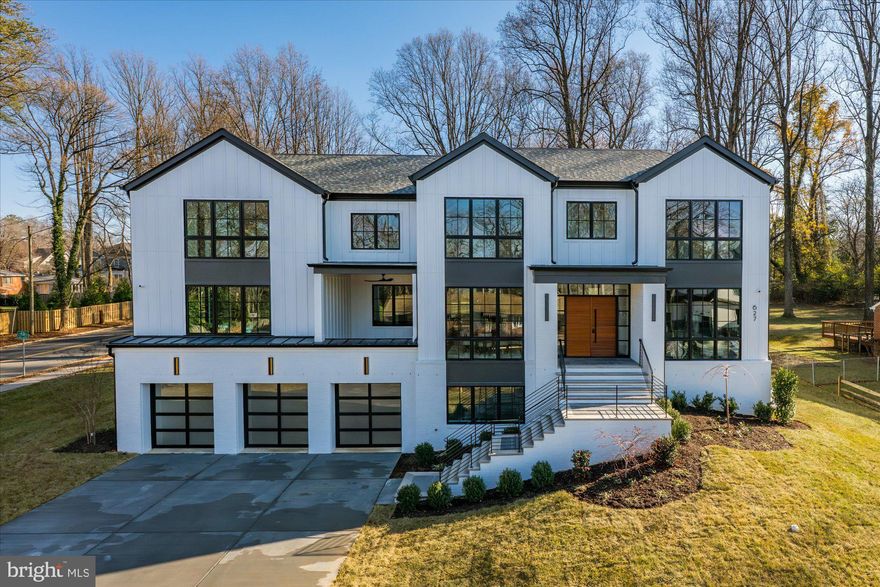 Welcome to one of the most exceptional offerings of 2025. 627 Hine Street represents a thoughtful collaboration between one of the area’s most revered luxury home builders, Morbill Custom Homes, a stable presence in the DMV for 40+ years, and a visionary landowner, the result is literal perfection.
 
An ultra flexible, 9,000 square foot floorplan lends itself to every lifestyle – 6 Bedrooms (each with its own full bath) and 2 Powder Rooms sprawl across 3 beautiful levels (each with elevator access). This homage to functional beauty is sited on one of the largest lots (.65 acre) in one of the most beautiful neighborhoods in Vienna, this is your needle in the haystack.

Main Level Features:
Gracious covered entryway with cedar ceiling; oversized double mahogany front entry doors with transom windows; expansive foyer with tray ceiling; European white oak wide plank engineered hardwood flooring throughout; signature rounded wall corners; millwork so meticulous it feels as if from an another era; professional grade Cook’s Kitchen with large thickened waterfall island, quartz countertops, full backsplash, 2 walk-in pantries, “Command Center”, Miele side-by-side panel ready 60” fridge/ freezer, Miele 48” gas commercial grade range top, Miele 30” double oven, 2 24” dishwashers, high-end cabinetry with soft close drawers/doors and decorative end panels; Butler’s Pantry with high-end cabinetry, sink and 24” Avallon undercounter beverage refrigerator; spectacular 2-story Great Room with 2-sided gas fireplace and double sliding doors leading to Sun Porch; Screened in Sun Porch with porcelain floors, fireplace, and cedar ceiling; Casual dining room with beamed ceiling & slab fireplace; Office with illuminated tray ceiling and a wall of custom built-ins strategically positioned at front of home; Formal Dining Room with illuminated floating tray ceiling; large covered porch off dining room; Bedroom #5 with double walk-in closets, Full Bath with shower; Powder Room (1 of 2); Elevator to all levels
Upper-Level Features:
Hardwood flooring continued throughout from main level; 4 Bedrooms all with Full Baths en-suite and walk-in closets; dramatic lounge area with gas fireplace open to Great Room below; large Laundry Room with sink and cabinetry ; Primary Suite with sitting area, breakfast bar/coffee station with sink and beverage refrigerator, 2 large, walk-in closets, Primary Bath with WC, Linen Closet, separate tub and shower and dual vanities; Elevator to all levels 
Lower-Level Features: 
large Recreation Room w/ LVP flooring; Bar area featuring sink, beverage refrigerator, dishwasher and leathered granite countertop; Exercise Room (or Bedroom #7) with double doors, large egress window, mirrored wall, and rubber floor tiles; Bedroom #6 with large closet and Full Bath with tub en-suite; Powder Room (2 of 2); access to 3-car garage (under home for an expansive main level) just 1 steps up to Mud Room with built in cubbies; large Utility/Storage Room; Elevator to all levels

Other Interior Features:
4-zones each controlled by Ecobee programmable thermostats (lower level, 1st floor, 2nd floor and Owner’s Suite) 2 Carrier Gas Furnaces with AprilAire humidifier, 2 Carrier AC Units; 2 Rinnai tankless HWH.

Exterior Features: Brick, Board on Batten, and Hardie Plank, lower-level entry, 3-car garage with Avante doors, Windsor pinnacle series windows and doors, lifetime Architectural roof shingles, porcelain pavers at walkway, front and rear porches, wrought iron railings, oversized black gutters with round downspouts.

Area Features:  Within walking distance of Whole Foods, The Fresh Market, Vienna Town Center, fine and casual dining (Natta Thai, Caboose Brewing Company, Taco Bamba, Hawk & Griffin, etc...), Vienna Community Center, Nottoway Park, Vienna Town Green, Patrick Henry Library. 3 miles to Vienna Metro (Orange Line) and 4 miles to Tysons Corner Center, easy access to 495, 95, 66, 123 and DC