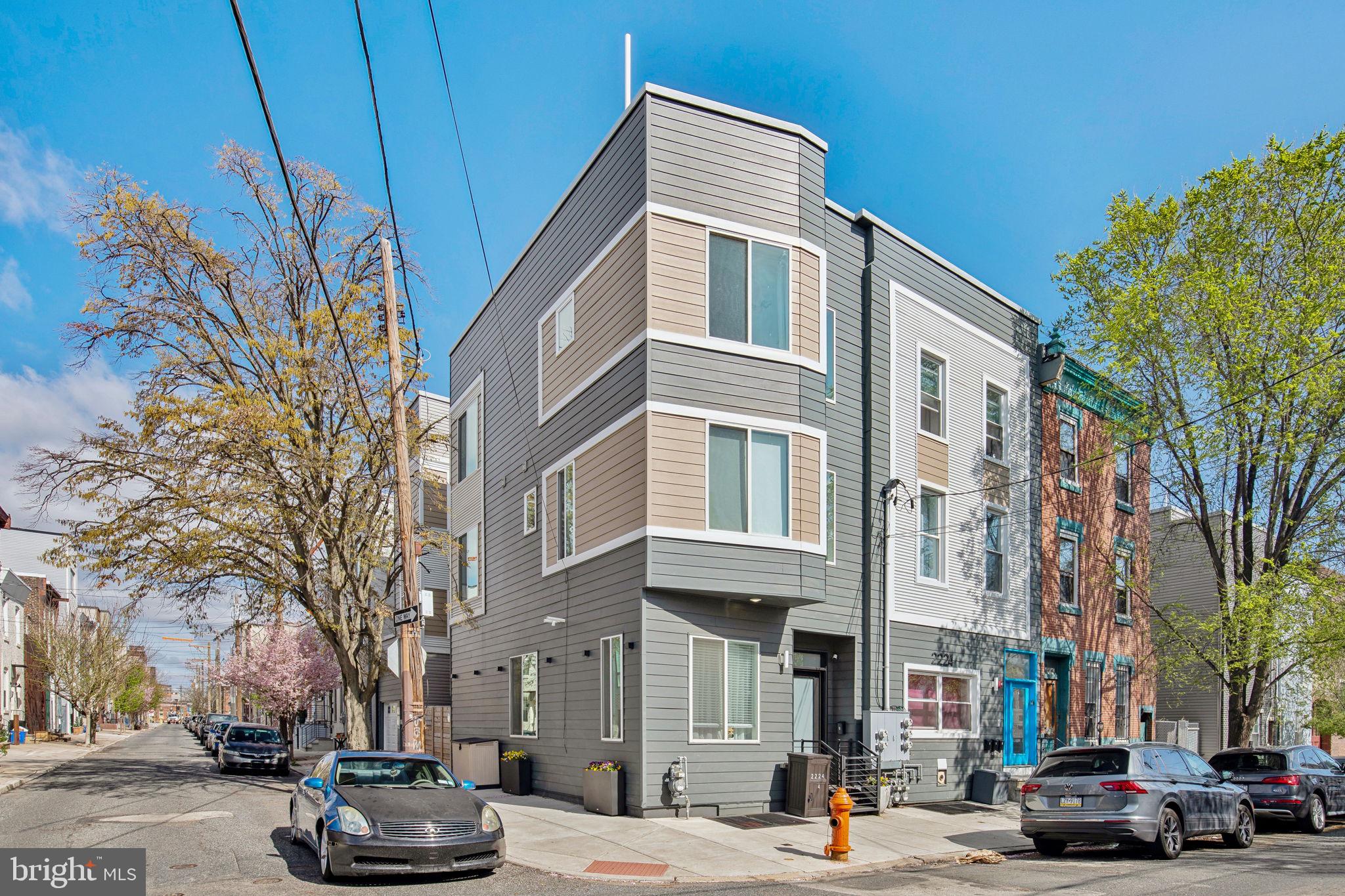 Welcome to 2224 Amber Street #4! This stunning, sun-drenched 4 bedroom, 3 bath CORNER home is located in one of Philadelphia's hottest neighborhoods, Fishtown/East Kensington, one block from Frankford Avenue's most talked about shops and restaurants! This well cared for home has all the perks of quality new construction including 6.5 years remaining on the TAX ABATEMENT with all the benefits of thoughtful owners.
Step inside to a warm, light-filled living space that flows seamlessly into the bright and airy open-concept kitchen. The kitchen is a true showstopper, featuring stainless steel appliances, gas cooking, a stylish tile backsplash, stone countertops, and a spacious island. Just beyond, step out to your private back patio, perfect for morning coffee or evening grilling.
The second floor offers two well-designed bedrooms, each with large windows and generous closet space. A tastefully appointed full bath with a double vanity and tiled shower sits just down the hall, along with a conveniently-located laundry closet with full-sized washer and dryer. As you make your way upstairs, you'll notice sun streaming through the hall window, a rare and charming feature in the city.
The third-floor primary suite —bathed in natural light and spacious enough for both your bedroom set and a cozy seating area, is a true retreat. The en-suite bath is a sunny oasis, complete with a walk-in closet, double vanity, tiled shower, and a soaking tub that invites relaxation. Just outside the suite, a minibar leads the way to the expansive roof deck, where you’ll enjoy breathtaking skyline views.
The lower level includes an additional bedroom with full bath, offering privacy for a guest bedroom, home office or den and an area for your Peloton and weights. For the dog lovers, this level also features a pet spa, perfect for rinsing off Rover after a long walk!
Located just steps from Frankford Ave, this home is walkable to Fishtown's best restaurants, bars, cafés, gyms, and boutiques. With the SEPTA El just minutes away for direct access to Center City & University City, plus quick access to I-95 for seamless travel to the airport, NYC, and NJ, this location is truly unbeatable!