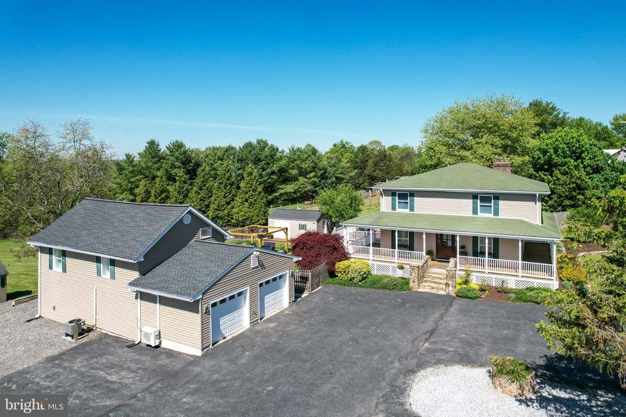 OPEN HOUSE Sunday 1pm - 3pm*Welcome to this truly one-of-a-kind updated custom home featuring a stunning accessory dwelling above a 2-car detached garage, all situated on a beautifully landscaped 1-acre lot in southern Westminster*The exterior offers exceptional curb appeal & outdoor living with a full wraparound covered porch, maintenance-free rear deck, patio walkway leading to a firepit area, fenced backyard, oversized asphalt circular driveway, & additional parking ideal for a camper or multiple vehicles*The property also includes 2 storage sheds, a dedicated grilling patio, & a detached in-law suite above the garage—perfect for multi-generational living or a private work-from-home setup*The garage is also heated & cooled with an additional storage space*Inside the main home, you’ll find new paint, new carpet, upgraded hardwood flooring, ceramic tile, & thoughtful updates throughout*The gourmet kitchen (remodeled in 2020) is a true centerpiece featuring granite countertops, center island, custom backsplash, stainless steel appliances, & a spacious walk-in pantry*A formal dining room provides the perfect setting for both everyday meals & special gatherings*The great room showcases a striking stone-front wood-burning fireplace complemented by updated lighting, while the main level also includes a conveniently located & updated half bath*Upstairs, enjoy new carpet, modern black railings, & fresh paint throughout*Two generously sized bedrooms, each with walk in closets—one with hardwood flooring—are complemented by an updated full hall bath*The primary suite is a standout retreat, complete with a gas fireplace, walk-in closet, & a beautifully designed spa-like bathroom featuring double vanities, tiled flooring, & an oversized custom walk-in shower*The lower level of the main home provides an added storage space along with key upgrades including a new hot water heater, newer water quality system, newer HVAC, & a new well pressure tank for added peace of mind*The detached upper-level living space offers incredible flexibility with a full kitchen featuring stainless appliances, open-concept living & dining area, an additional bedroom or office, & a full bath with walk-in shower*Outdoor living is unmatched—relax on the porch, deck, or patio, or gather around the firepit for evening enjoyment*The fenced yard is ideal for pets, while the additional half-acre of flat open field beyond provides endless opportunities for recreation or sports*This property is truly a rare find with an extensive list of updates available in disclosures—too many to list*