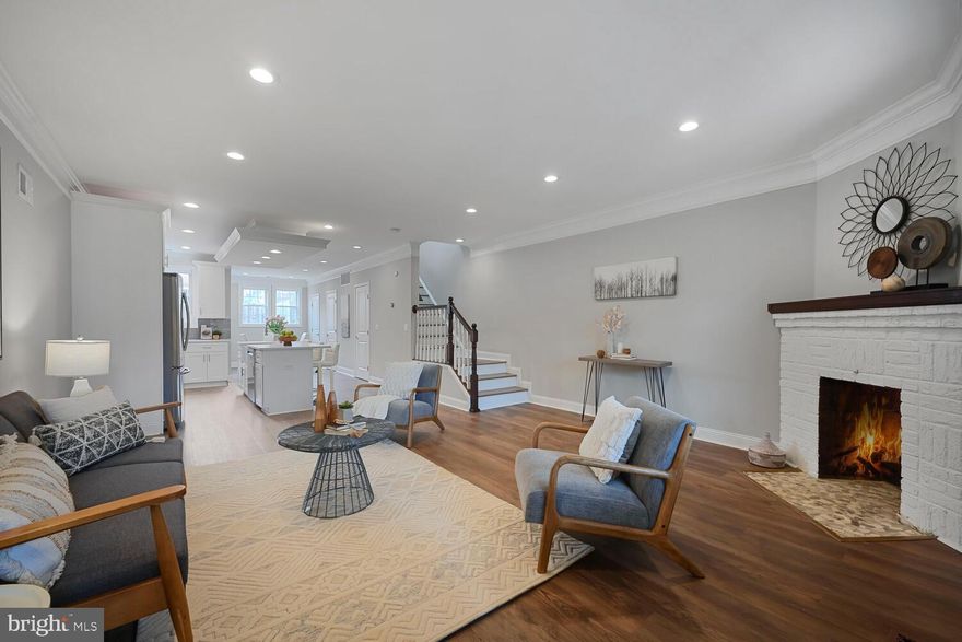 Stunning Petworth rowhome with brand new luxury vinyl plank flooring throughout the main and upper level with nearly 2,400 s/f of interior living space spread across three finished levels with 4 bedrooms, 3.5 bathrooms, a detached garage, fully fenced front & rear yards, covered front porch, & sunny rear patio. Fantastic open-concept main level w/spacious living area, decorative fireplace, a chef’s kitchen with stainless-steel appliances, plenty of cabinet & pantry space, and a large prep & entertaining island, a dining alcove, plus a powder room. Upstairs, 3BR & 2BA, laundry, luxury spa-like baths & light-filled rooms. Fully finished lower level is bright w/neutral interiors & tiled floors, another decorative FP, 4th BR, dry bar, and a 3rd full bath w/walk-in shower. Roof replaced in 2019. Enjoy convenient access to public transportation (Fort Totten & Georgia Ave/Petworth Metro stations a little over a mile away ) and bus service on the block; walk score of 76 translates to a very walkable, bikeable location.