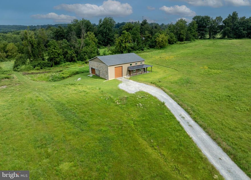 Welcome to 1245 Fairview Road, a rare and exceptional offering in the heart of East Nantmeal Township, Chester County. This stunning 29+ acre estate offers partially wooded land and open pastures on rolling country with a large stream fed pond on the property, as well as a newly-built home and large oversized garage. The immaculate custom-built home features 4 bedrooms and 3 bathrooms and a thoughtful design throughout. A true standout feature is the oversized garage, designed to accommodate an RV, horse trailer, or multiple vehicles with ease—making it ideal for hobbyists, traveling enthusiasts or simply extra storage! The 29+ acres is on non restricted land and offers an opportunity to build an exquisite home with expansive views