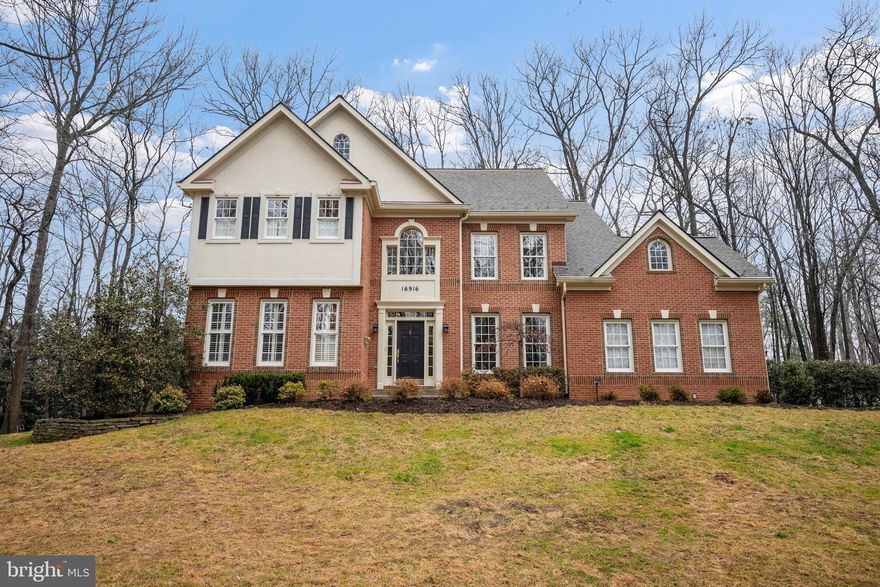 Nestled on a wooded 1-acre lot, this immaculate home boasts over 5,000 square feet of living space.  Enter the main level through the 2-story foyer with dual sided staircase. The main level features an updated kitchen, sunken family room, den/study, living room, dining room, sunroom and mudroom. The kitchen, renovated in 2021, is the focal point of the main floor with its expanded center island, WOLF 5 burner gas cooktop, granite counters, custom cabinetry, and Jen Air double ovens. The sunken family room boasts a wood burning fireplace while the living room, dining room, and sunroom with ample windows provide additional entertaining spaces. The main level study/den make for a great work from home space and the large mudroom with washer/dryer, updated counter, sink, tile floor, and under cabinet lighting make for a great space to kick off your shoes as you enter from the garage. Upstairs you will find an expansive primary suite with sitting room, tray ceilings, custom dual walk-in closets, and an updated primary bath with heated floors, expanded shower, soaking tub, marble tile, double vanity, and more. Three additional bedrooms on the second level along with a hall bath with updated flooring, tub, tile, vanity, and dual sinks.  Bring your game table and big screen to complete the expansive lower level which includes two larger entertaining spaces, wet bar with wine refrigerator, full bath, wine closet, and ample storage. The private 1.25 acre lot includes a large shed, spacious stone patio, and the whole house generator provides peace of mind. Many recent improvements including new 80 gallon water heater in 2026, new driveway in 2022 which was seal coated in 2024, new well tank 2024, new main level A/C  in 2021 and new roof in 2020. Too much to list here, shows well.