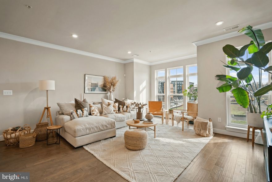 Refined, light filled, and beautifully scaled, this townhome style residence at Georgia Row offers the comfort of a row home with the ease of condominium ownership. Built in 2019 and ideally positioned directly across from The Parks at Walter Reed, this 2 bedroom, 2 full bath, 1 half bath home offers approximately 1,800 square feet across three levels, along with a private rooftop deck spanning the full length of the residence.
Interior highlights include wide plank wood flooring, quartz countertops, GE appliances, custom painted cabinetry with upgraded hardware, oversized windows with transoms, and a large kitchen island with adjoining flexible space for dining, office, or lounge use. The main level is filled with natural light and offers an open layout that functions beautifully for both everyday living and entertaining.
Upstairs, the primary suite is privately situated at the end of the hall and features dual closets and a windowed en suite bath with dual vanity and separate water closet. At the opposite end of the hallway, the second bedroom is exceptionally spacious, with two closets including one walk in closet, and is served by a full hall bath with tub and shower.
Above the bedroom level, the private rooftop deck is a true standout, complete with water and electric. Overlooking treetops, Takoma, and the green spaces of The Parks at Walter Reed, it offers a rare outdoor retreat with beautiful sunset views.
Additional features include assigned parking space P24, secure entry with intercom, and a boutique building with only 3 residences. Located minutes from Takoma Metro on the Red Line, Takoma Park, and Silver Spring, the home offers exceptional convenience. Directly across the street, The Parks at Walter Reed brings together Whole Foods, Starbucks, dining, retail, and beautifully maintained green spaces in one of Northwest DC’s most exciting destinations.