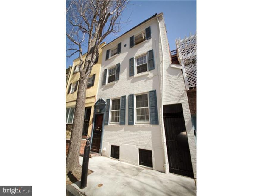 Pride of ownership truly lies in this lovingly maintained 3 bedroom, 2.25 bath home on a beautiful tree-lined block in the desirable Rittenhouse Square area with wood floors, open den, red brick patio yard and more! Foyer entrance leads in the open living and dining room with hardwood floors, 2 front windows, built in shelving, track lighting, gas fireplace with marble mantle and coat closet. Kitchen boasts tile floor, white cabinetry, recessed lighting and lovely breakfast area with sliding glass doors out to a peaceful private red brick yard with planters and easement to Hicks St. On the second floor you'll find a front bedroom with tons of closets, a nice wide open den with carpeting, fireplace mantle and skylight, plus a full 4 piece expanded tile bath with large sun-filled skylight, double vanity, large Jacuzzi type tub, stall shower and double closet. The third floor offers a front bedroom suite with wood floors, 2 windows, 2 closets, A/C unit and full bath with stall shower. There is an additional bedroom on this floor. Super clean basement makes the ideal spot for storage while also hosting mechanicals, laundry facilities and toilet. This beautiful, perfectly located abode will not last!