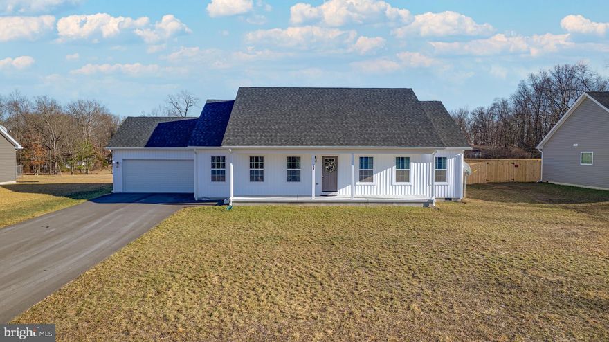 Welcome to your dream home! This charming ranch-style home, built only one year ago, offers the perfect blend of modern style. Nestled at the end of a lane this location offers both peace and privacy with no HOA.  The open floor plan with vaulted ceiling seamlessly connects the living and dining areas and creates a spacious atmosphere from the moment you walk in the front door. The heart of the home is the well-equipped kitchen with stainless steel appliances. farmhouse sink, and granite counter tops. Whether you're preparing a cozy meal or hosting a gathering, this kitchen is designed for both functionality and style. There are three spacious bedrooms with the master on one side and guest bedrooms on the other. Master bath features dual sinks and large walk-in shower with sliding glass.  Relax out back on the new 12x12 deck.  The attached front-entry garage accommodates two vehicles comfortably. Enjoy the peace of mind that comes with a property that's still very much a brand-new home.  Don’t miss the opportunity to make this your new home! Call Today!