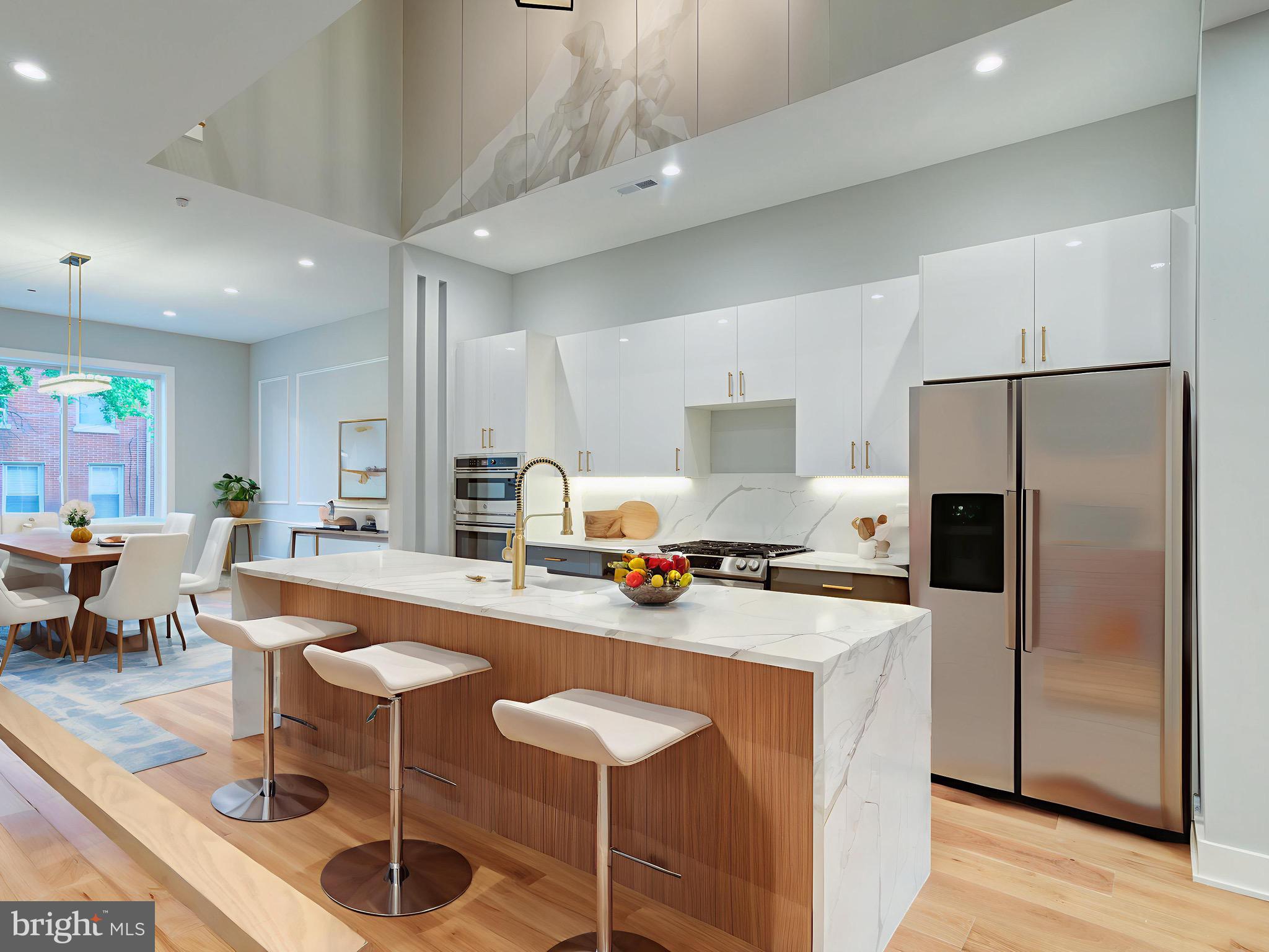 ASK us about getting a mortgage rate BELOW 5 percent FOR 5 YEARS through the Builder Buy-down special! Welcome to 1021 E Palmer St, a modern and elegant, one-of-a-kind, new construction townhome in the vibrant Fishtown neighborhood of Philadelphia, where luxurious design meets contemporary living. Step inside to find an open floor plan that effortlessly blends style and functionality, creating a seamless flow between living spaces. This true masterpiece, boasting approximately 4100 sq ft of living space, 4 bedrooms plus an office and 4 baths. Enter the home and be captivated by a 2 story foyer and kitchen, the radiant and expansive interior, natural stunning hardwood floors, and 9-foot ceilings throughout. The heart of the home is the luxurious Italian kitchen, featuring sleek 2 toned cabinetry and top-of-the-line GE appliances. The countertops are crafted from exquisite quartz, providing both beauty and durability, while the island serves as a perfect gathering spot for family and friends. Elegant pendant lights hang above, casting a warm glow over the space. Adjacent to the kitchen is a spacious dining area, perfect for hosting dinner parties or enjoying casual meals. Large windows allow natural light to flood the space, showcasing views of your private backyard. The living room is thoughtfully designed for relaxation, custom shelving, modern electric fireplace as a focal point. This inviting area flows seamlessly into the kitchen and dining space, making it ideal for entertaining.
Ascend to the upper levels on a custom staircase to find two spacious bedrooms, stacked brand new washer dryer set in hallway, and a full designer bathroom with the most luxurious finishes and tile work. Bedrooms offer immense amounts of natural light and ample closet space. The master suite on the third floor is a private sanctuary, featuring massive walk-in closets with custom built-ins, a luxurious bedroom area, and a lavish master bathroom with modern soaking tub, luxurious stand-in shower and elegant double vanity. On the same level a flexible living space can serve as an office, a media room, or an additional guest area. In the finished basement you can find the 4th bedroom with its own full bath offering privacy to visitors, teenagers. 1021 E Palmer St is a perfect blend of urban living and modern luxury in this exquisite Fishtown townhouse, where every detail is meticulously curated for both comfort and style. This home is a true testament to contemporary elegance and is perfect for those who appreciate the finer things in life.