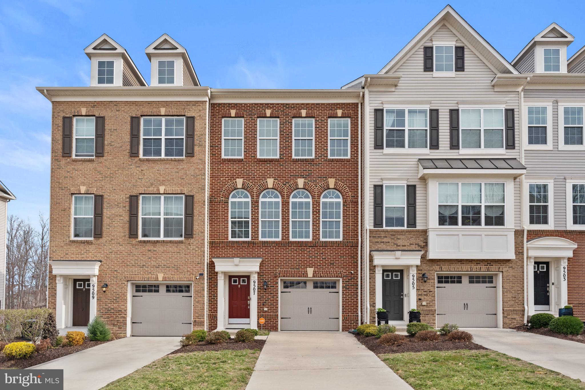 Welcome to 9507 Sycamore Grove, located in the sought-after Smith Home Farm community of Upper Marlboro. Spanning 1,976 square feet across three thoughtfully designed levels with numerous upgrades originally purchased by the seller, this home seamlessly blends style, comfort, and functionality. Upon entry, the welcoming hallway leads to a spacious family room that opens to the rear yard, creating a perfect space for relaxation or entertainment. A convenient powder room and two closets complete this level. Upstairs, the open-concept layout connects the gourmet kitchen, dining area, and living room, making it an ideal space for both everyday living and hosting guests. The living room extends effortlessly to a private balcony, perfect for enjoying fresh air, serene views, and the South-facing dining room enjoys attractive views from a wall of Palladian windows. The third level is dedicated to rest and retreat, featuring a luxurious primary suite with a large walk-in closet and a spa-like bathroom. Two additional bedrooms provide versatility for a home office or a personal gym. A full hall bathroom, a linen closet, and a laundry room ensure convenience for family and guests alike. Garage parking and additional driveway parking complete this special offering.
Situated in a vibrant, amenity-filled community, where you will enjoy a fitness center, outdoor pool, movie screenings and more, playgrounds, walking trails and wooded surroundings, with easy access to shopping, dining, and major commuter routes, this home offers a perfect blend of modern convenience and close-in, suburban charm.