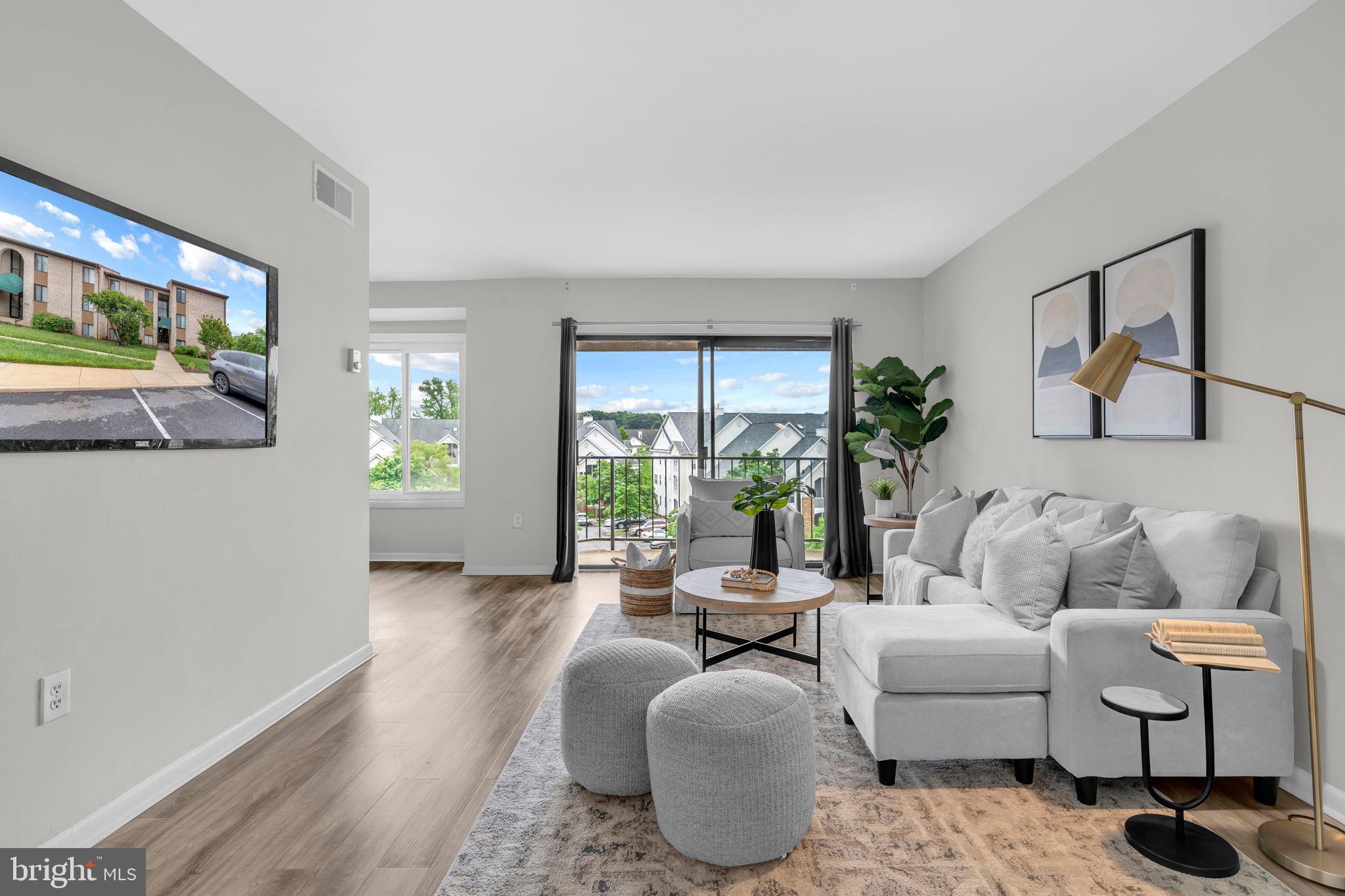 Welcome to 6916 Hanover Parkway #300! Step into this beautifully renovated, move-in ready 2-bedroom, 2-bath condo that combines modern upgrades with effortless living. The bright, open-concept floor plan is perfect for both relaxing and entertaining, with seamless flow to a private balcony that brings the outdoors in. Enjoy luxury vinyl plank flooring throughout and a fully updated kitchen featuring granite countertops, stainless steel appliances, soft-close cabinetry, and an abundance of natural light. A dedicated laundry area with an in-unit washer and dryer adds everyday convenience. The spacious primary suite offers a walk-in closet and a sleek, updated en-suite bath. A second fully renovated bathroom provides added comfort and style for guests or family. The condo fee covers all utilities, trash and snow removal, and maintenance of common areas—offering truly low-maintenance living. Take advantage of community amenities including a swimming pool, fitness center, tennis courts, picnic area, party room, car wash station, and dedicated commercial vehicle parking. Perfectly located just minutes from shopping, dining, public transit, I-495, the Baltimore-Washington Parkway, and the University of Maryland—this home offers the ideal blend of convenience, value, and lifestyle.