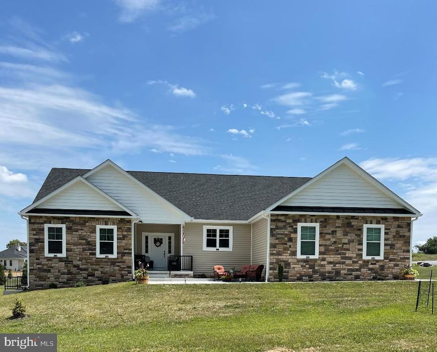 PRICE CORRECTION! FURTHER REDUCED AND MOVE IN READY! With building completed in 2022, this almost new custom built rancher is move in ready!  It is set on a nice corner lot in the beautiful Brookside neighborhood on the west side of Martinsburg, and it has all the most desirable features - open spaces with high ceilings, natural lighting and modern finishes, side load garage and an expansive unfinished basement, and a split bedroom floorplan for added privacy.  The home is centered around a large living area with family room, dining room, and kitchen, all with easy access to the fenced patio area and back yard.  The kitchen is outfitted with stainless steel appliances, full height cabinets, and a large island with counter-height seating.  There are 4 large bedrooms all on the main floor, a large unfinished basement to expand into, plus a great outdoor area for entertainment and outdoor dining.  An upgraded water treatment system and an oversized water heater were installed to provide comfort and relaxation in the free standing soaking tub and separate shower in the owner's suite.  Each of the 3 full bathrooms feature beautifully tiled floors and shower surrounds, plus upgraded vanities and countertop.  The rest of the main living areas feature low-maintenance plank flooring that accentuates the fireplace features and custom wall color.  Since ownership sellers have installed a 12x25 rear patio and a 14x14 front patio! The owners are negotiating on their own "dream home" so are making this wonderful property available based on the success of those negotiations.  This is truly one level living at it's finest.  Secure an opportunity to live in this premium neighborhood and home by making an appointment to view it today!