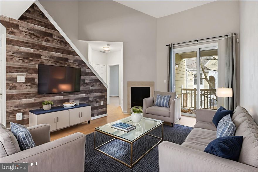 Renovated and rarely available Two Level Loft Style 2 BR / 2 BA 1,140 sq. ft Condo in Worldgate Condo Community that comes with one assigned parking space and is blocks from Silver Line Metro! Upon entry to unit, you are met by Kitchen / Dining / Living Room floorplan with neutral laminate flooring throughout entire main level.  Kitchen includes granite counters, stainless appliances, white cabinets, tile backsplash and storage.  Dining Room has custom bench with extra built-in storage.  Living room includes accent wall and gas log fireplace that leads to private and large patio for exterior living space.  Primary bedroom off living room with two large closets including walk-in and is near laundry area with large stackable washer / dryer combo and main level fully renovated full bathroom with gray cabinets, granite counters, dual sinks, expansive mirror and tub / shower combination with tile. Upstairs is enclosed loft area that can be used as second bedroom, with second full bathroom that includes stand-in shower. Along with one assigned parking space is plenty of visitor parking for guests. Community includes outdoor pool, fitness center and on-site management located in the community center. Close to the Toll Road / 267 and Route 28, Dulles Airport and the Silver Line Metro for commuting. Worldgate shopping center is nearby with restaurants, coffee, retail and movies. Pets to be considered on a case by case basis, with weight restrictions in the condo development.  A great location and beautiful condo, do not miss out! Disclaimer, some photos in listing are virtually staged in listing. Dogs are permitted on a case by case basis, no cats allowed. Property is available 1/17/2026.