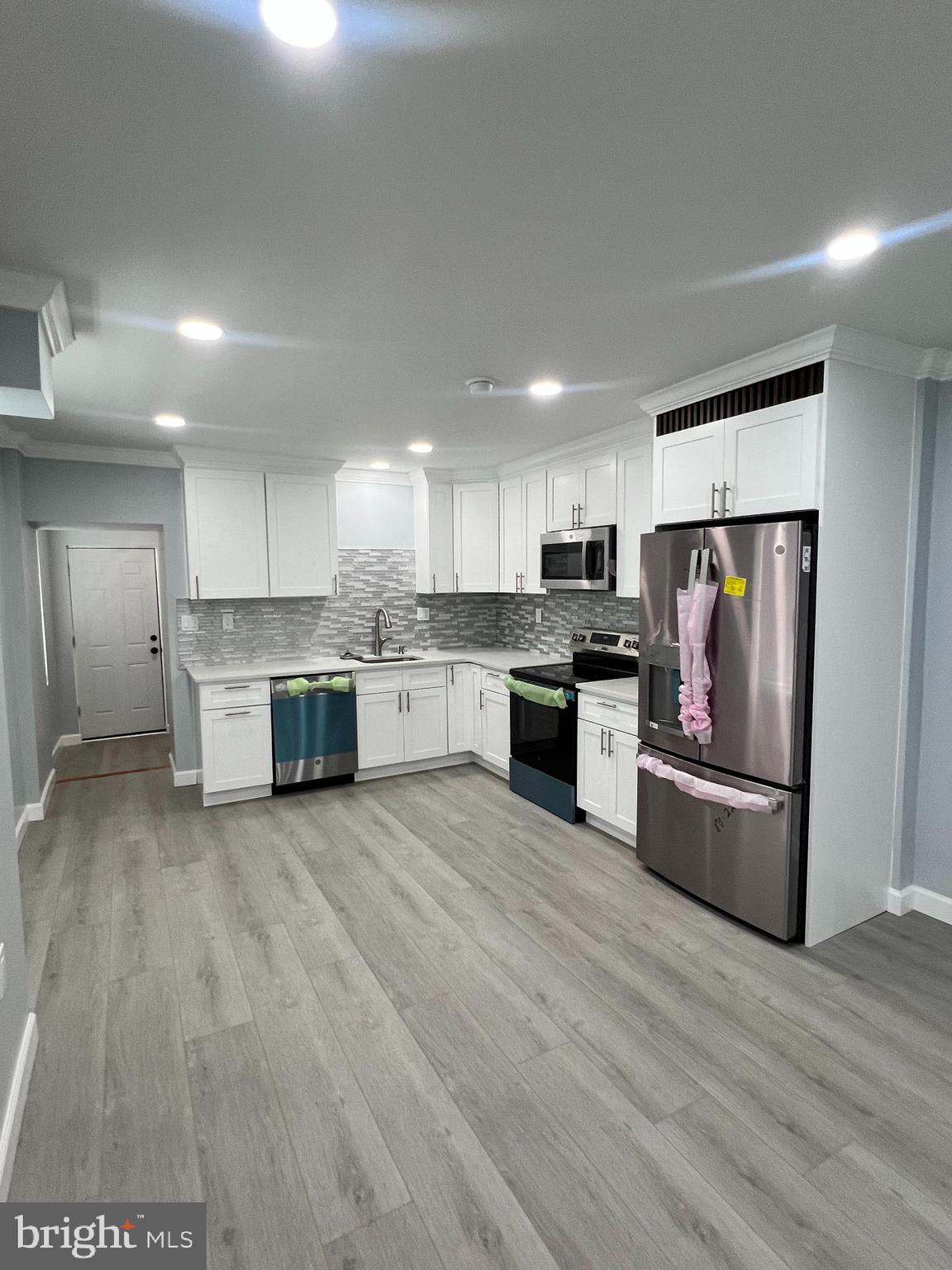Welcome to your new home! This beautifully renovated property is nestled in a convenient yet serene neighborhood, offering both tranquility and accessibility. Step inside to discover a modern open concept design, perfect for both entertaining and daily living. The home features three spacious bedrooms and TWO full pristine bathrooms, all adorned with brand-new finishes. Enjoy the elegance of new hardwood floors throughout and the sleek appeal of new appliances in the kitchen. The stunning countertops and cabinetry are sure to impress. Additional highlights include ample street parking available and generous storage space in the basement. This home blends style, comfort, and functionality—making it a must-see!