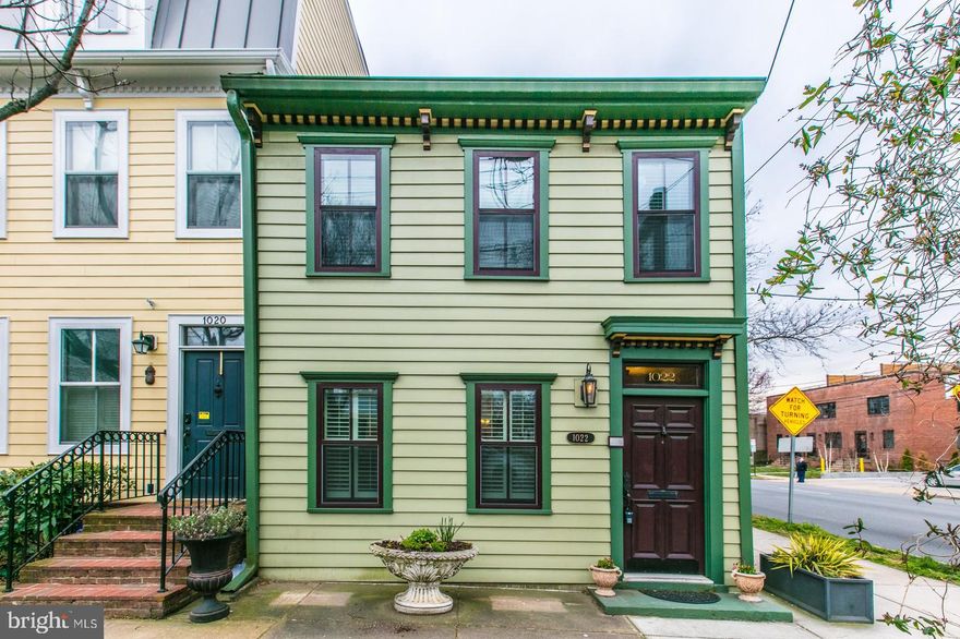 JUST SOUTH OF AMAZON HQ2 - A MUST SEE! SUN FILLED, CHARMING OLDE TOWNE ALEXANDRIA TOWNEHOUSE - END UNIT. Centrally located in the heart of Old Town Alexandria. Beautifully remodeled historic home features 3 Bedrooms, 2.5  bathrooms, WALK - IN CLOSETS and OFF-STREET PARKING.  Beautiful antique mantle adorns the fireplace (not functional) in the living room with old plank hardwood floors. Large dining room and open concept remodeled kitchen and powder room complete the main level. Master bedroom features a renovated En-suite bathroom with Antique Barn Doors, Walk-In Closet and spacious shower.  Bedrooms 2 and 3 share a renovated Jack and Jill bathroom.  Laundry on bedroom level! Charming private, fenced courtyard with a Wisteria covered gazebo. Off street parking behind in alley. Walk to metro, bus stop, Olde Towne shopping, restaurants, galleries and night life.